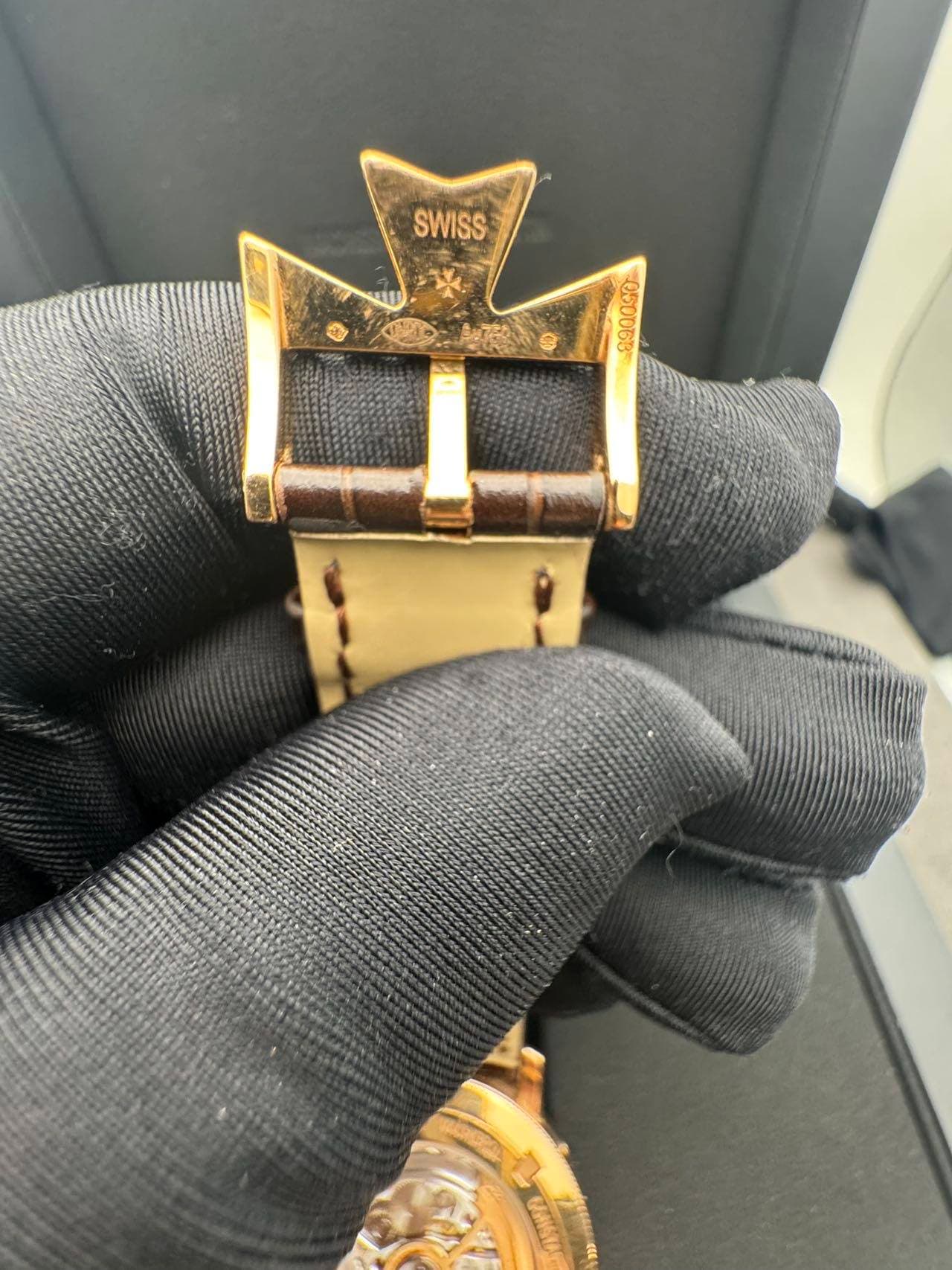 May be an image of wrist watch and leather