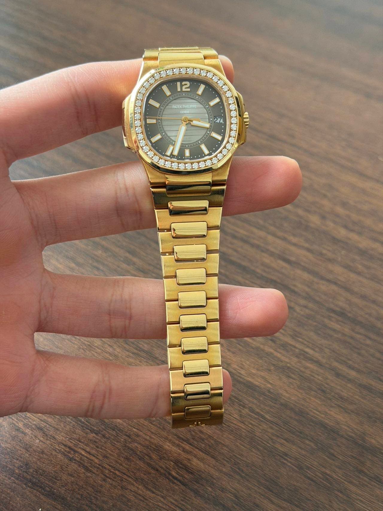May be an image of wrist watch and text