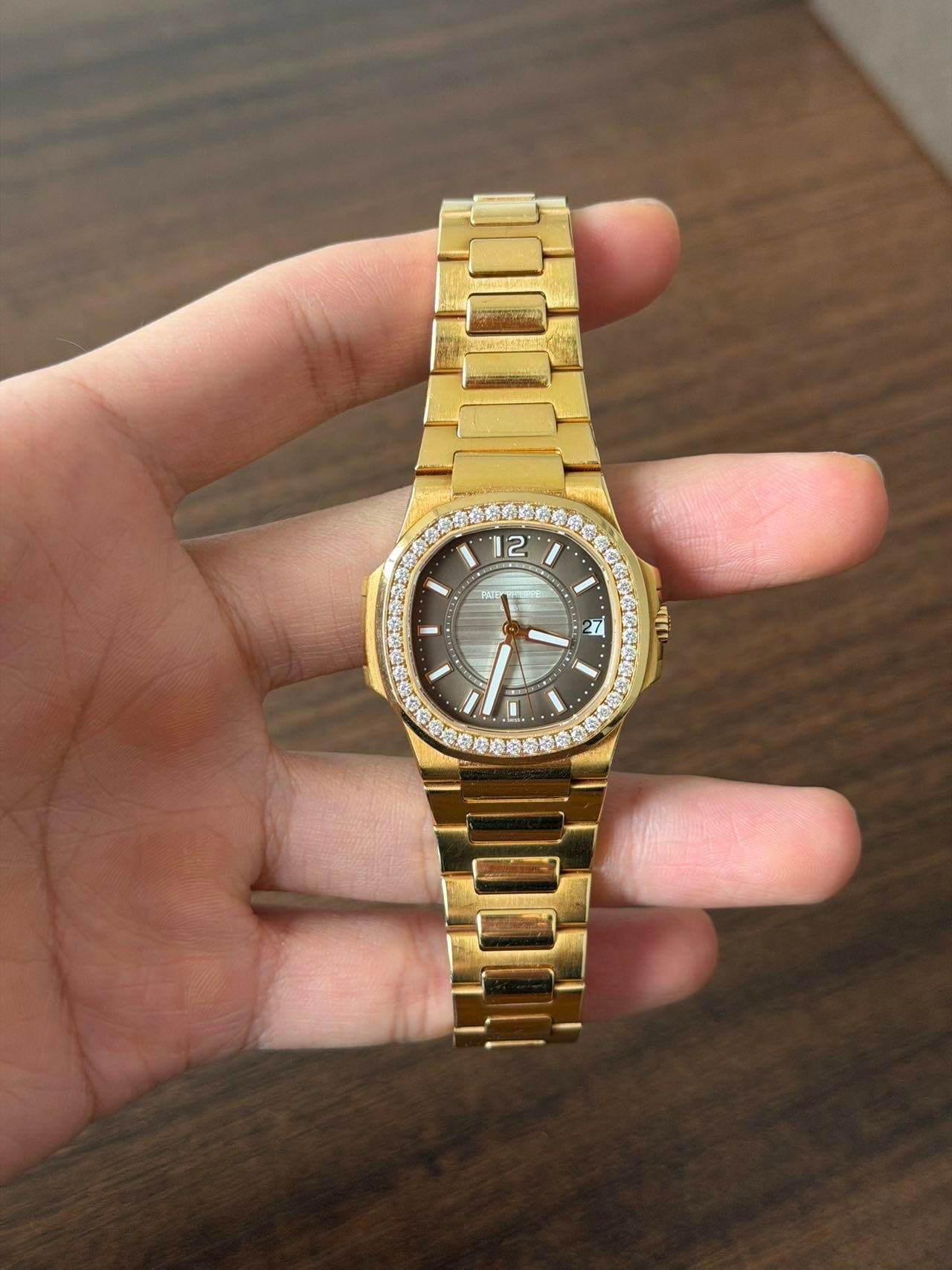 May be an image of wrist watch and text