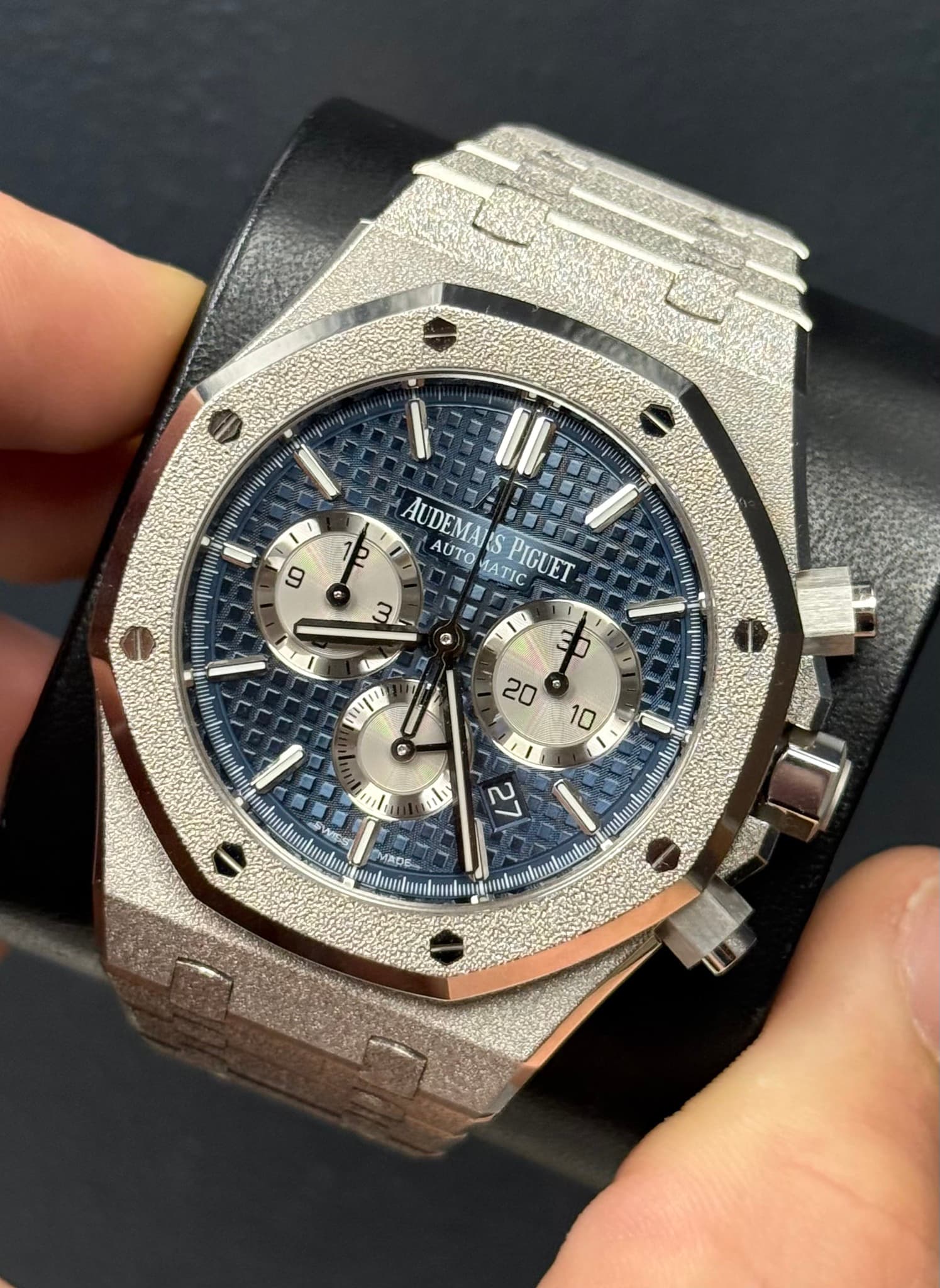 May be an image of wrist watch and text