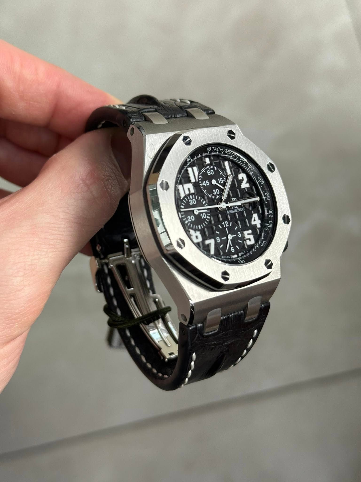 May be an image of wrist watch and text