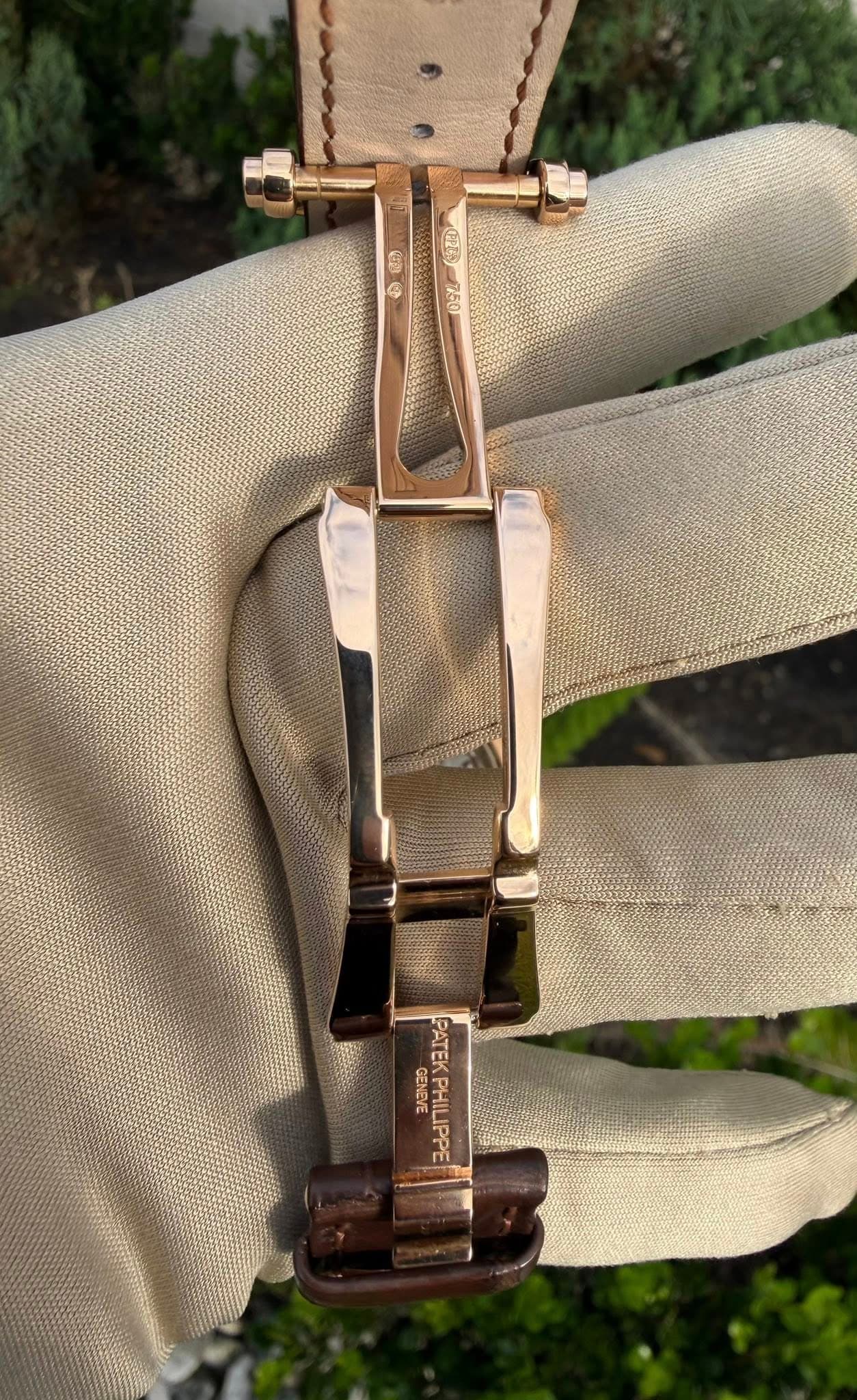May be an image of leather, brass, saddle-stitched leather and wrist watch