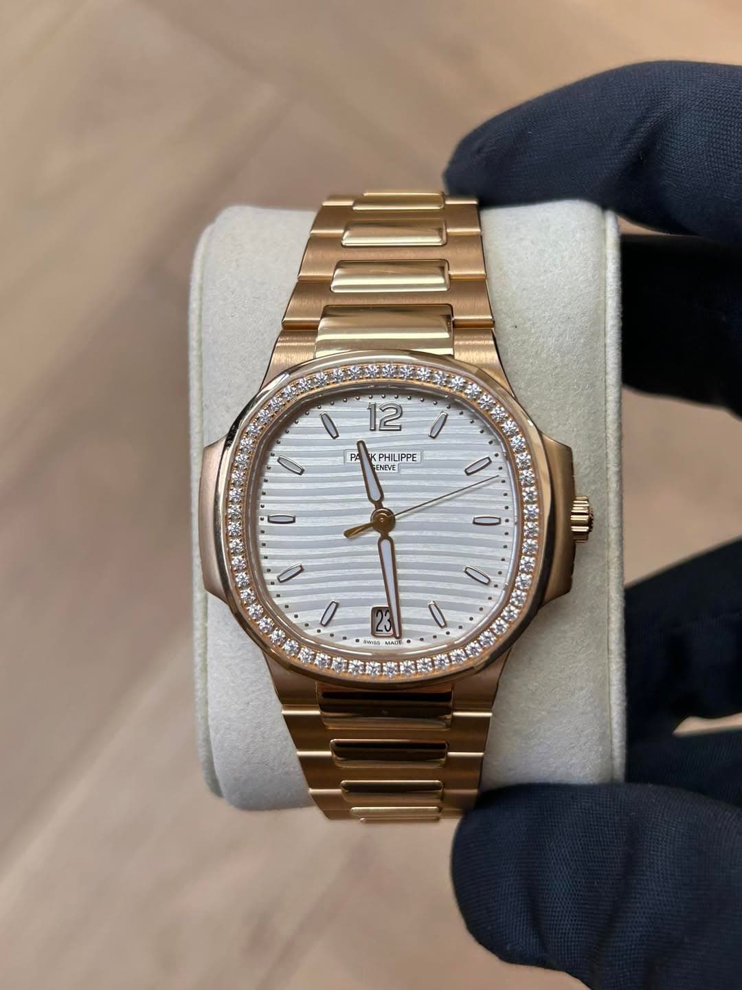 May be an image of wrist watch and text