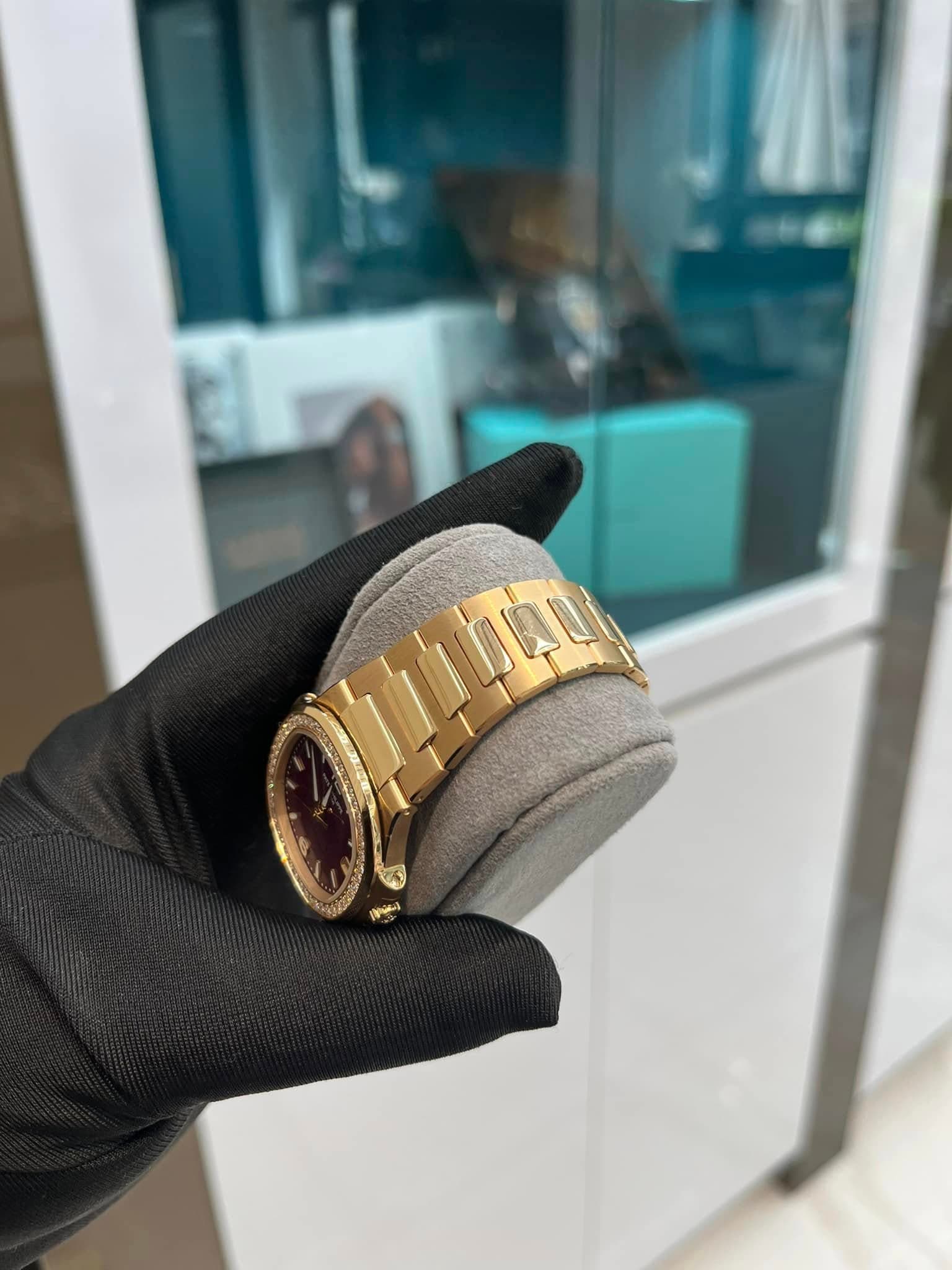 May be an image of wrist watch, ring and text