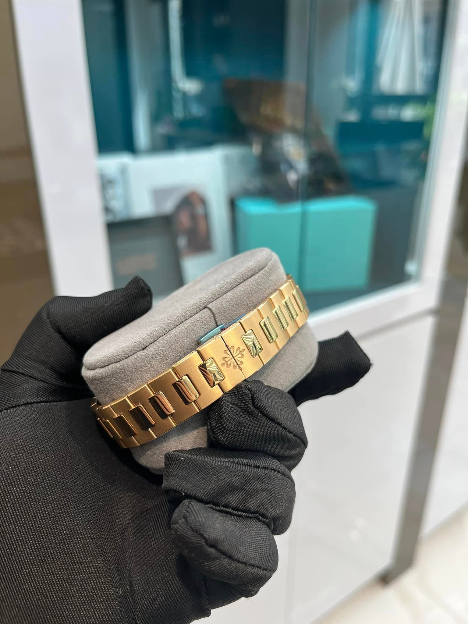 May be an image of wrist watch, ring and text