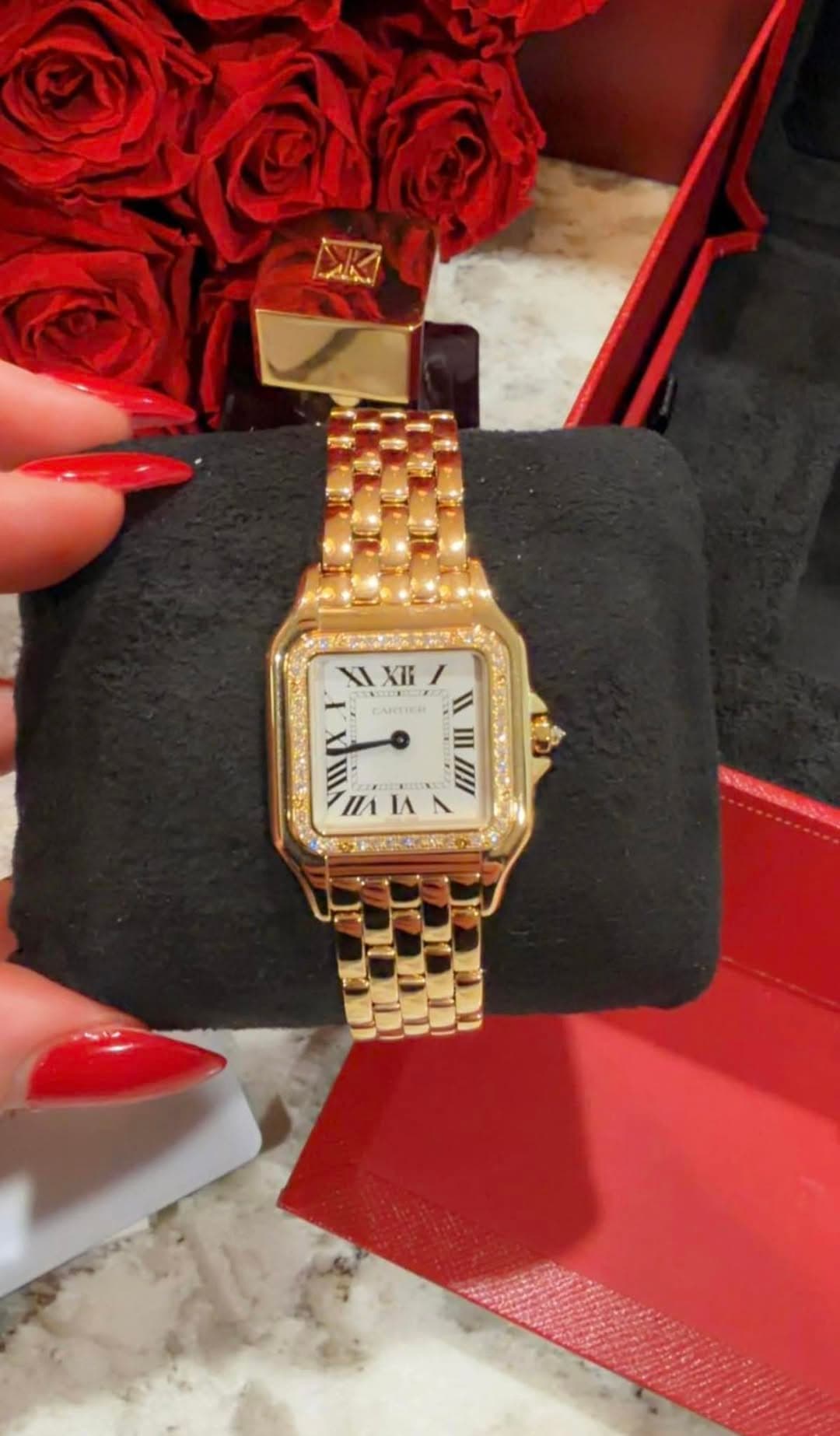 May be an image of wrist watch and text