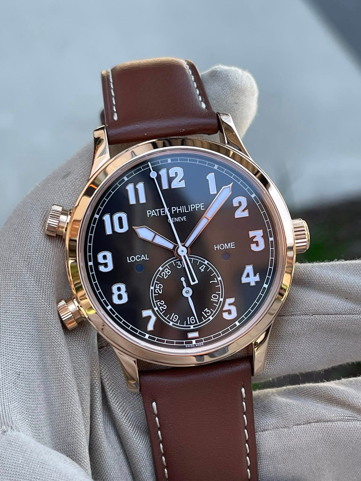 May be an image of wrist watch and text that says ' PAT PATEKPHILIPPE Ει PHILIPPE y2 1 ENEVE 3 4 ሳ 0 5 LOCAL HOME '