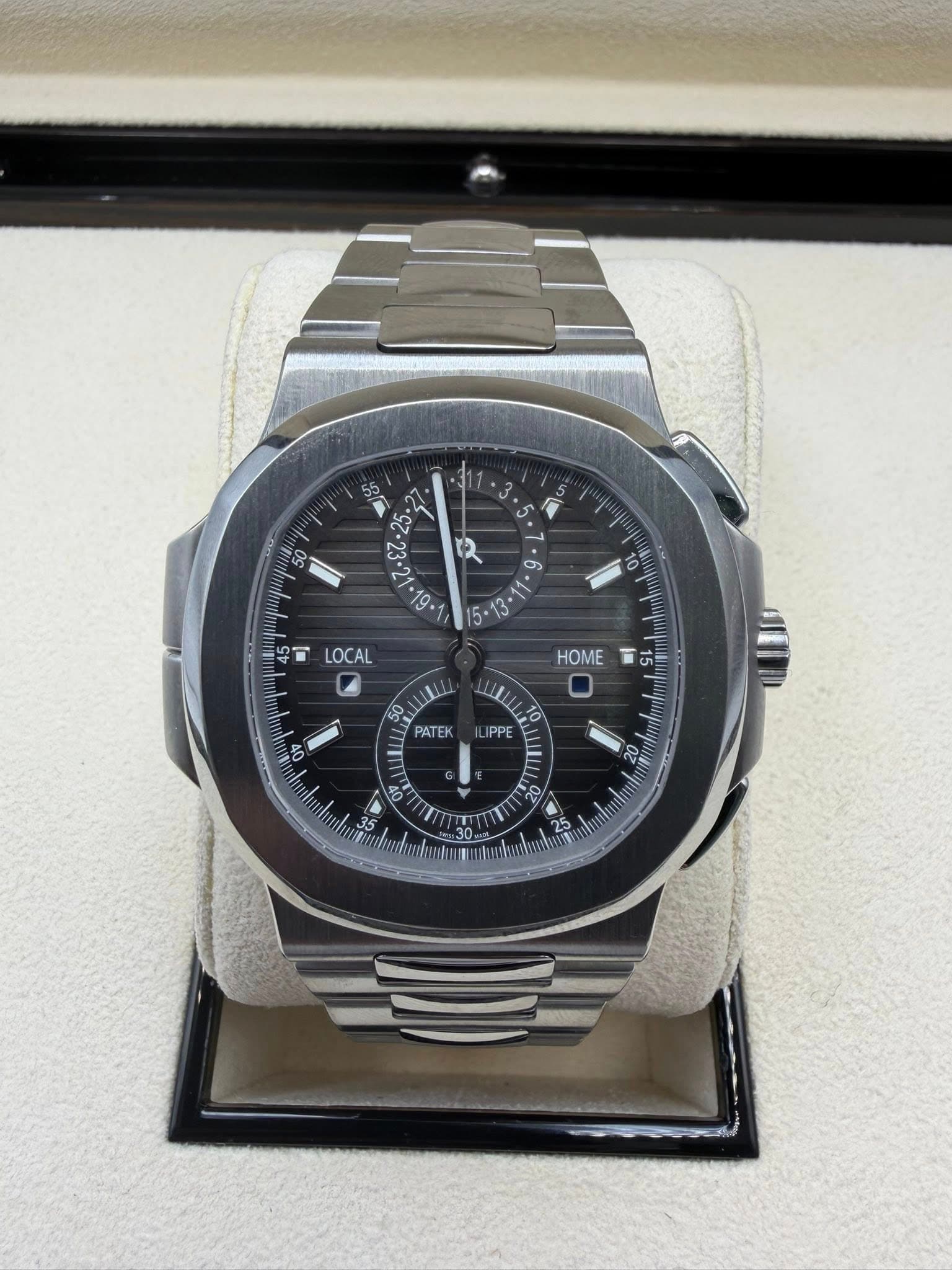 May be an image of wrist watch and text