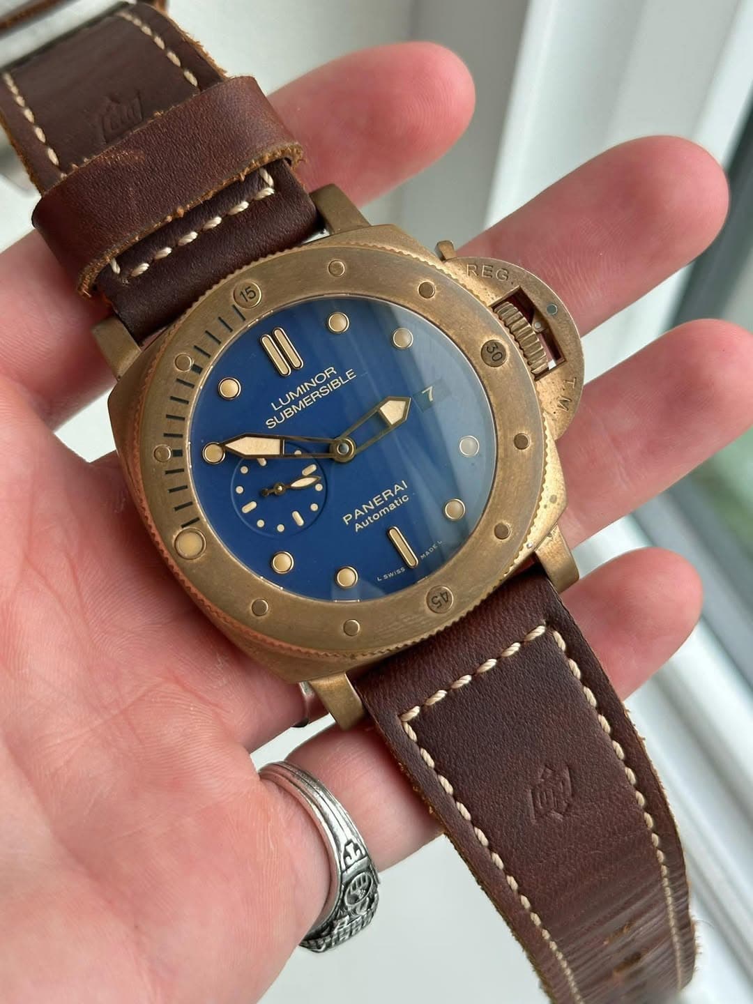 May be an image of wrist watch and text that says 'SREGT REG. ERTTA II LUMINOR SUBMERSIBLE E SU SUBME O PANERAI Automatic tic ROS かん'