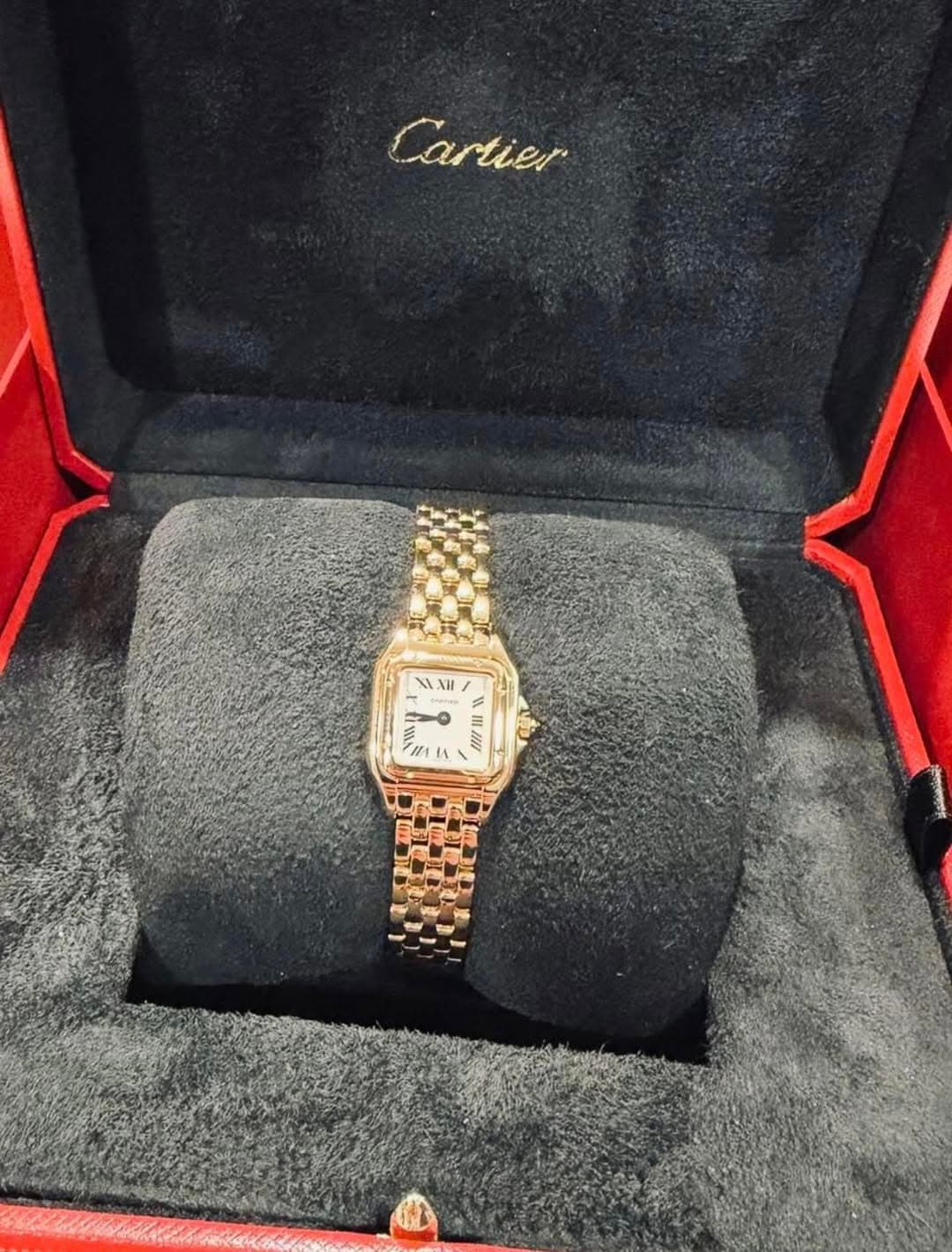 May be an image of wrist watch and text