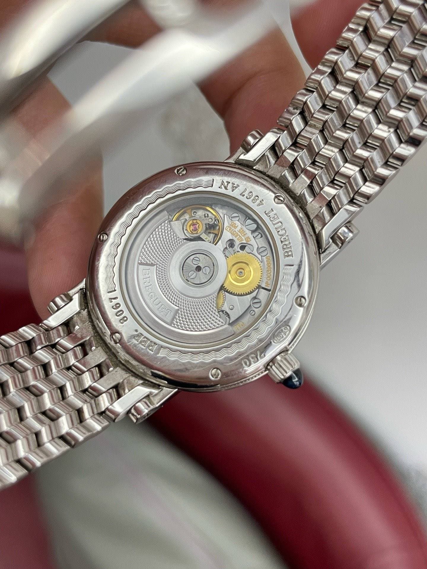May be an image of wrist watch and text