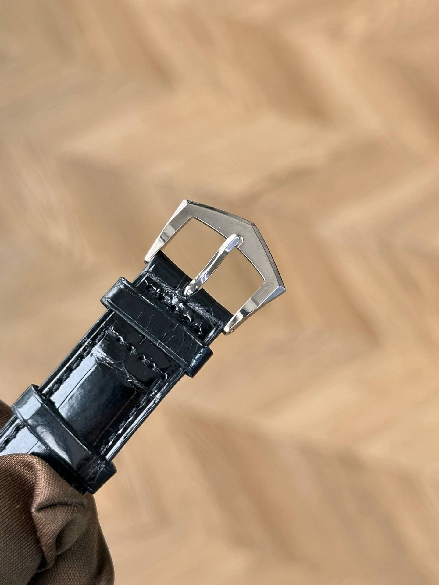 May be an image of leather, saddle-stitched leather and wrist watch