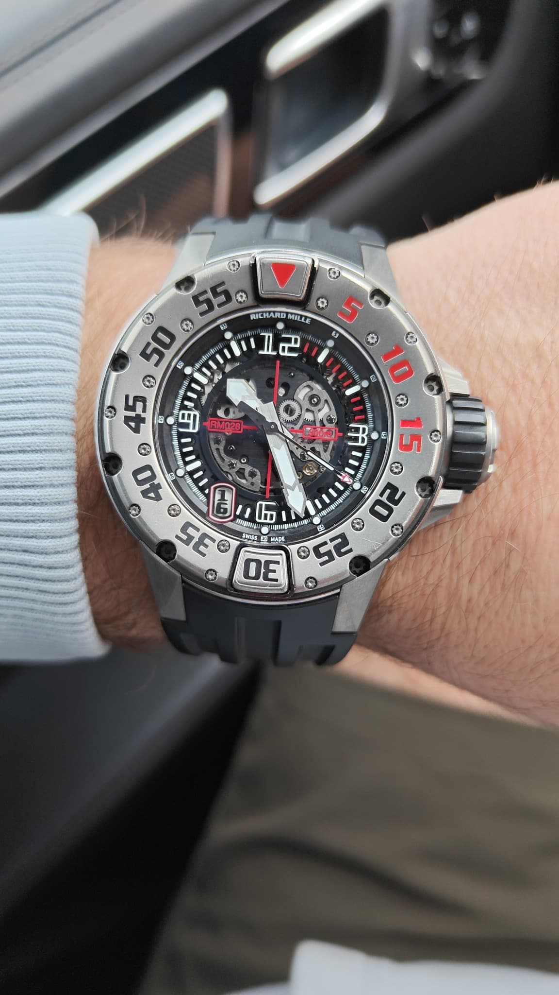 May be an image of wrist watch and text