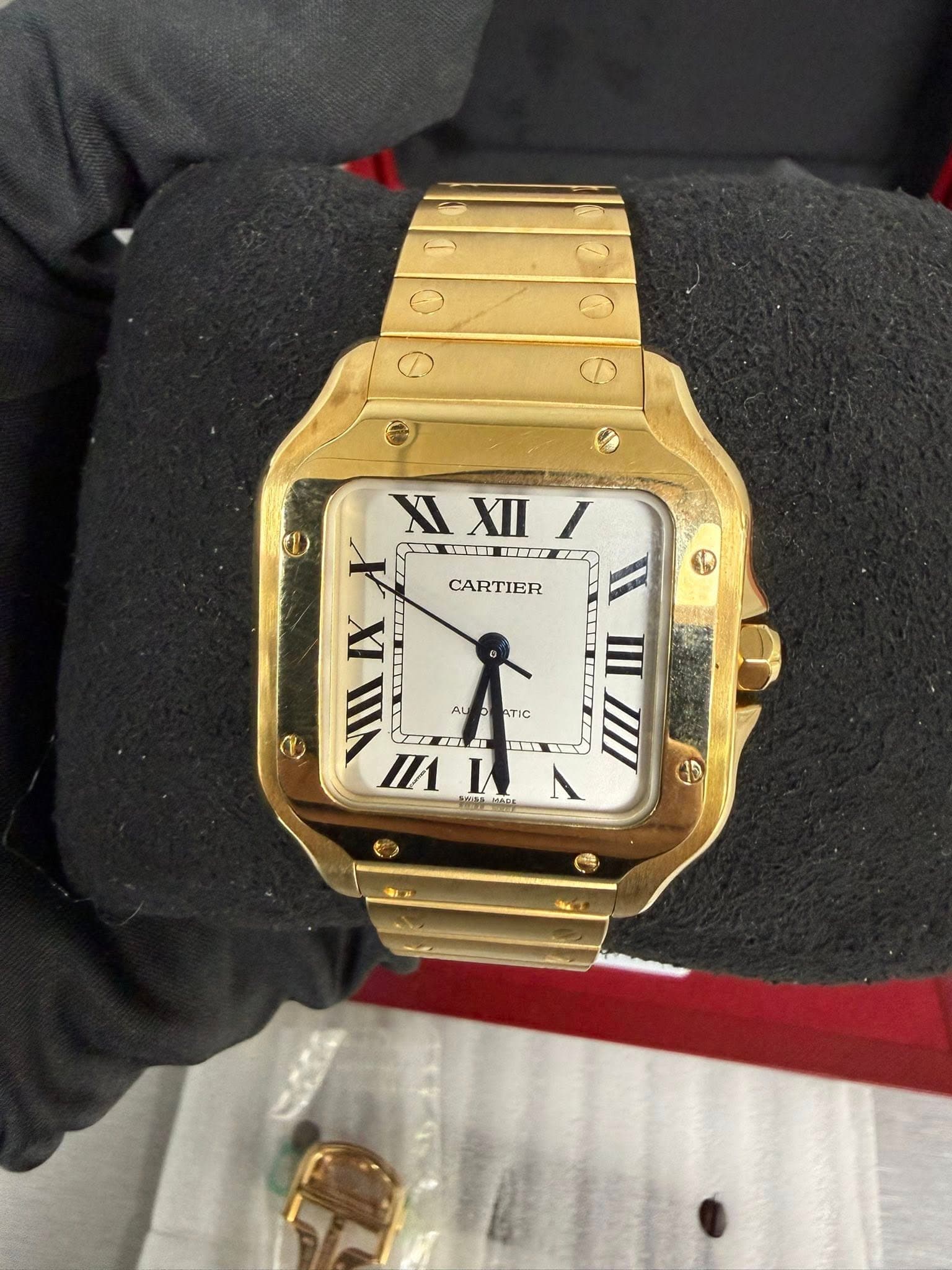 May be an image of wrist watch and text