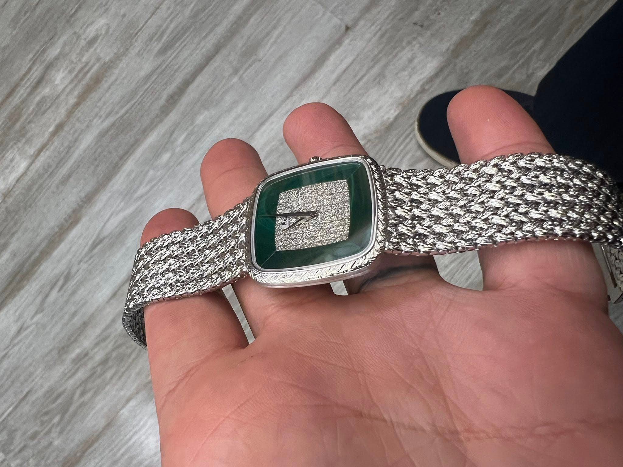 May be an image of wrist watch and text
