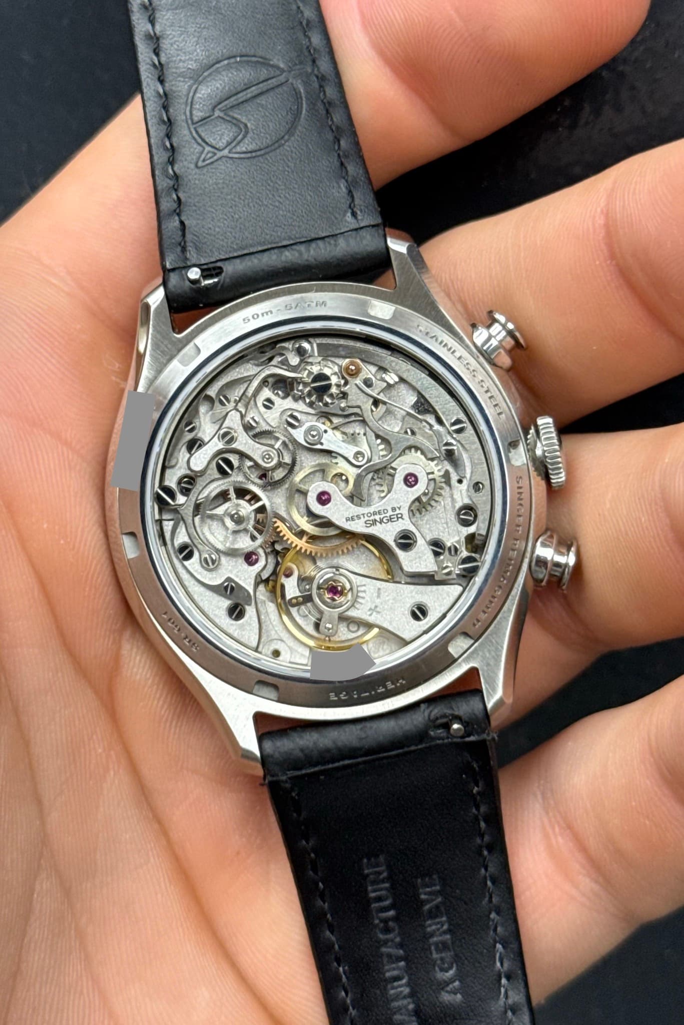 May be an image of wrist watch and text