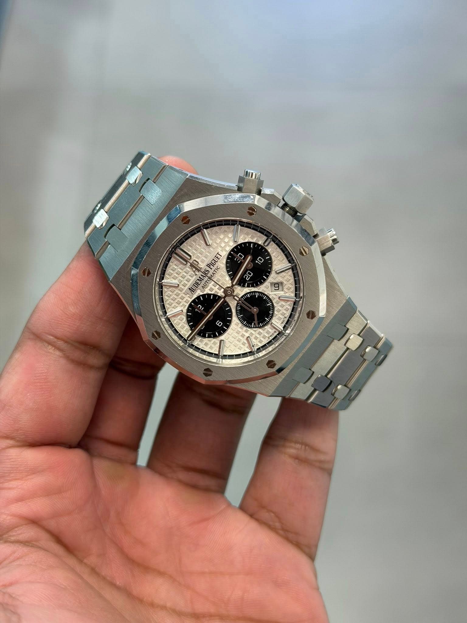 May be an image of wrist watch and text