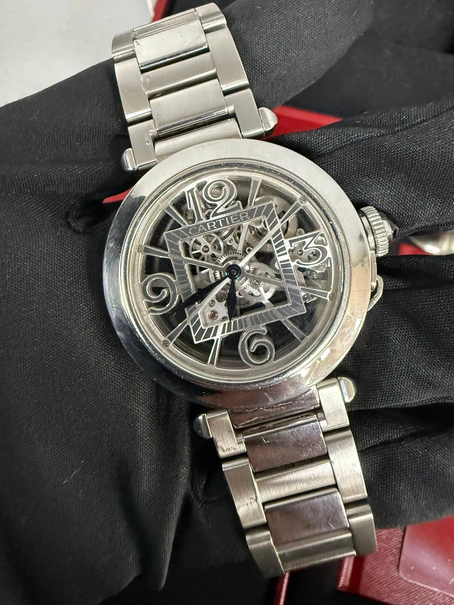 May be an image of wrist watch and text that says 'M2 CARTIER C I'