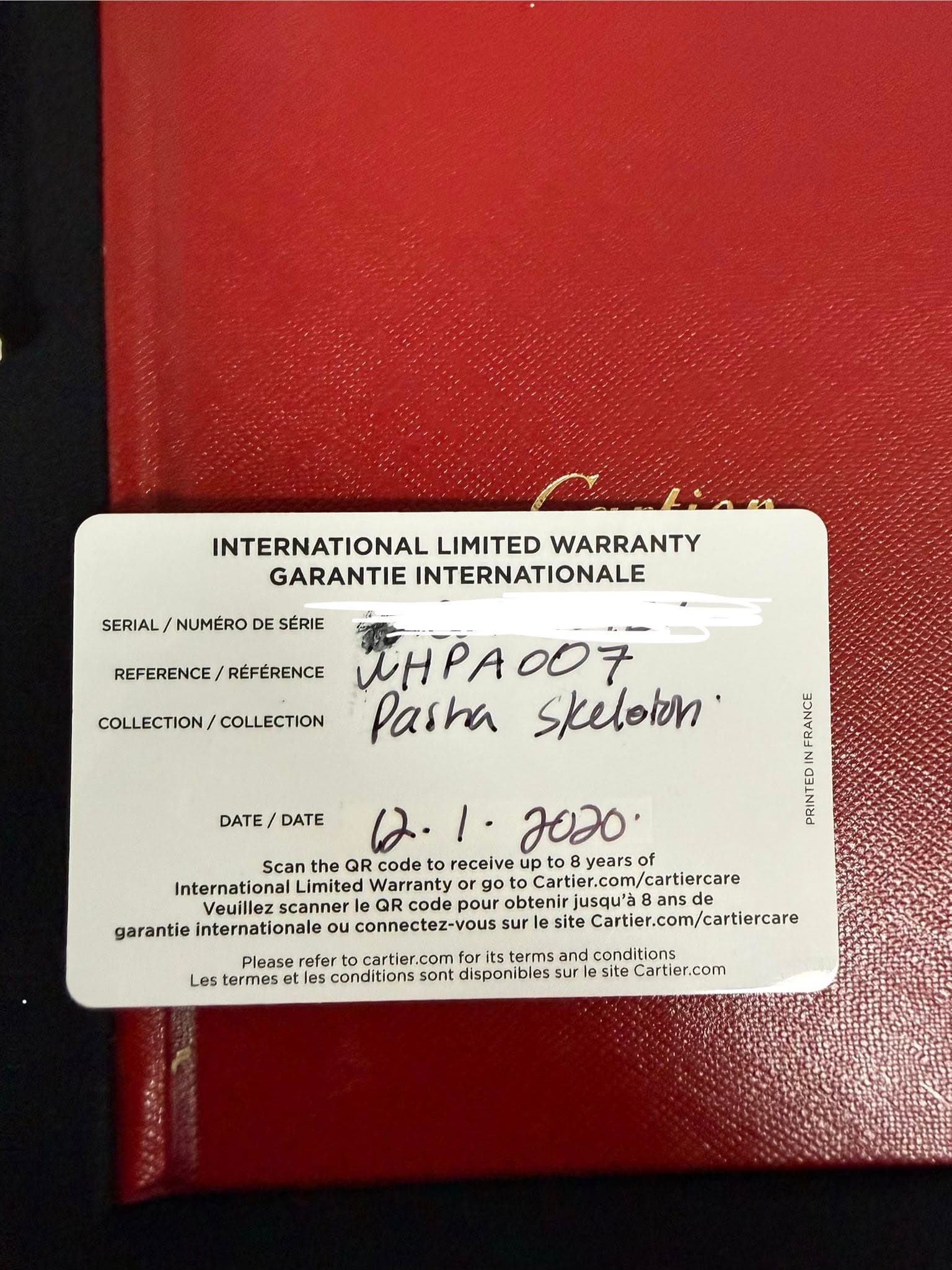 May be an image of ticket stub and text that says 'INTERNATIONAL LIMITED WARRANTY GARANTIE INTERNATIONALE REFERENCE/ RÉFÉRENCE SERIAL/NUMERODESERIE SERIAL/ NUMÉRO DE SÉRIE ИHPAOO7…