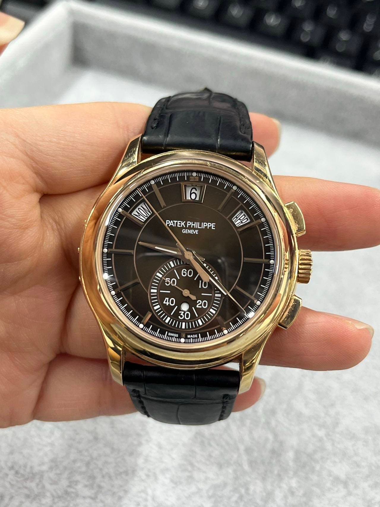 May be an image of wrist watch and text