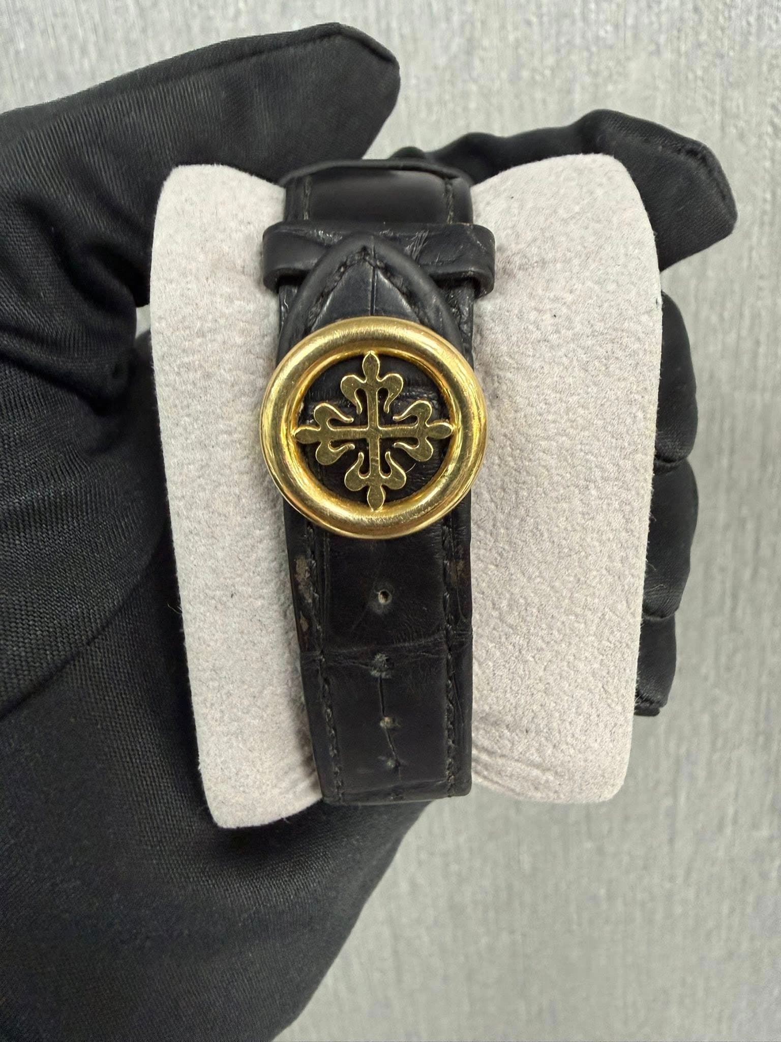 May be an image of leather and wrist watch