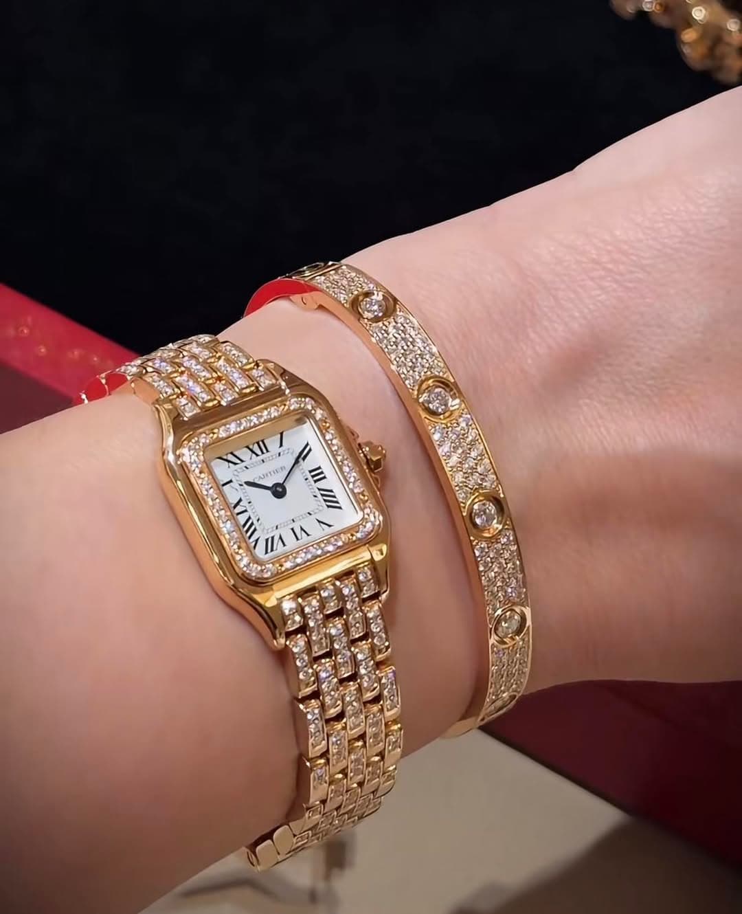 May be an image of wrist watch, jewelry and text