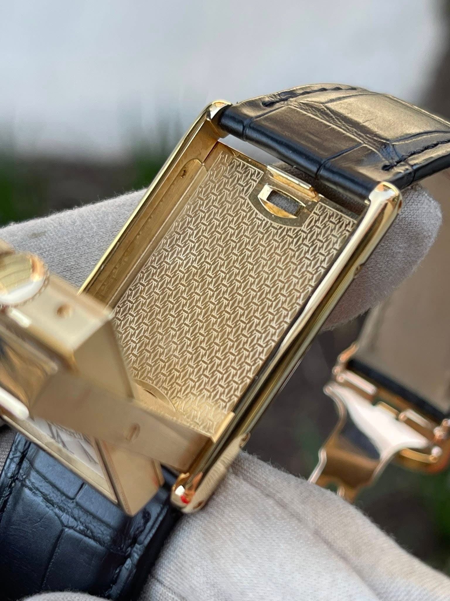May be an image of wrist watch and saddle-stitched leather