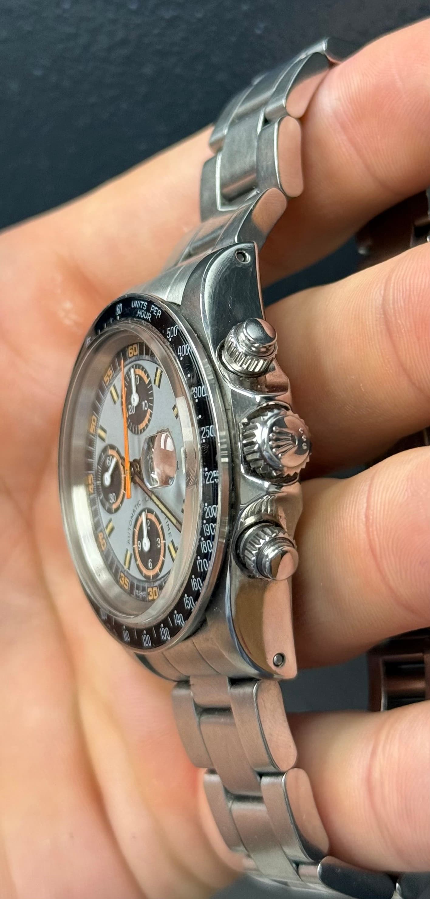 May be an image of wrist watch and text