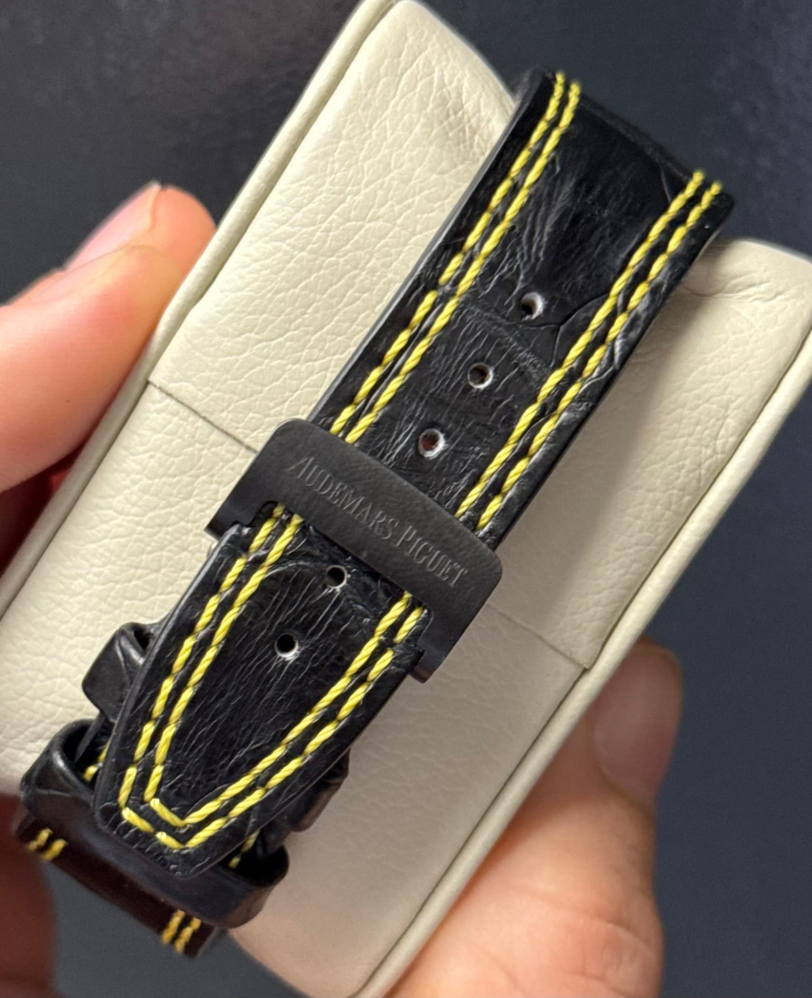 May be an image of leather, saddle-stitched leather, wrist watch and text
