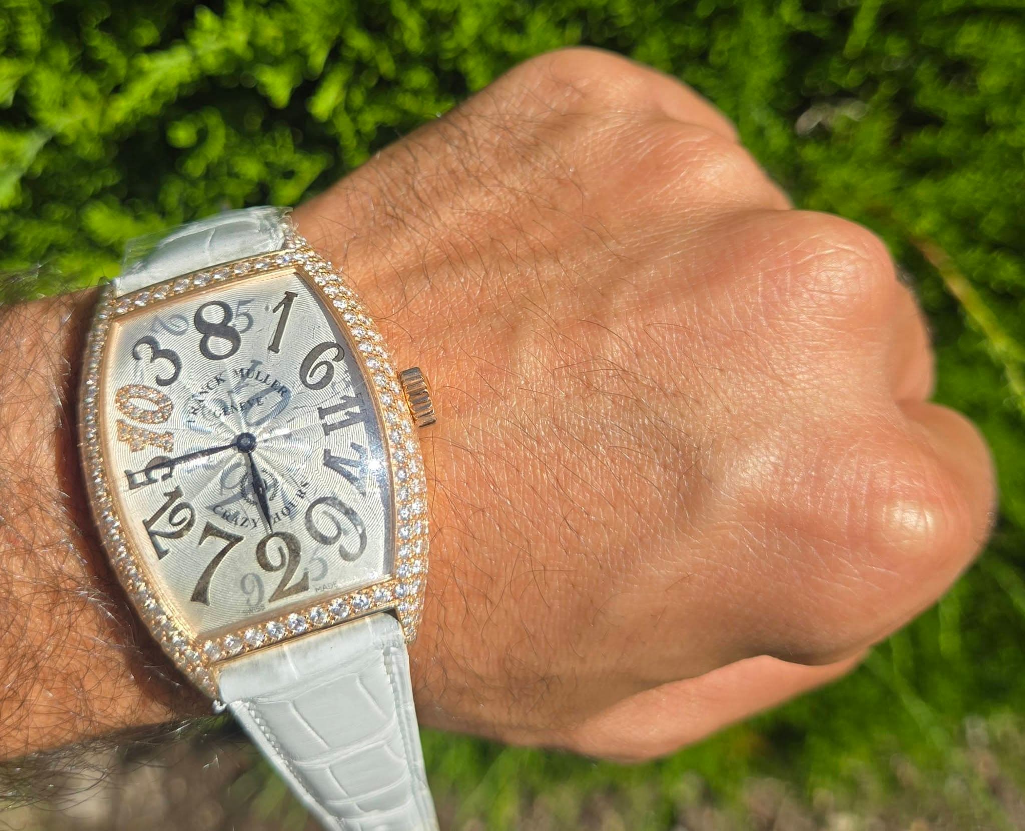 May be an image of wrist watch and text