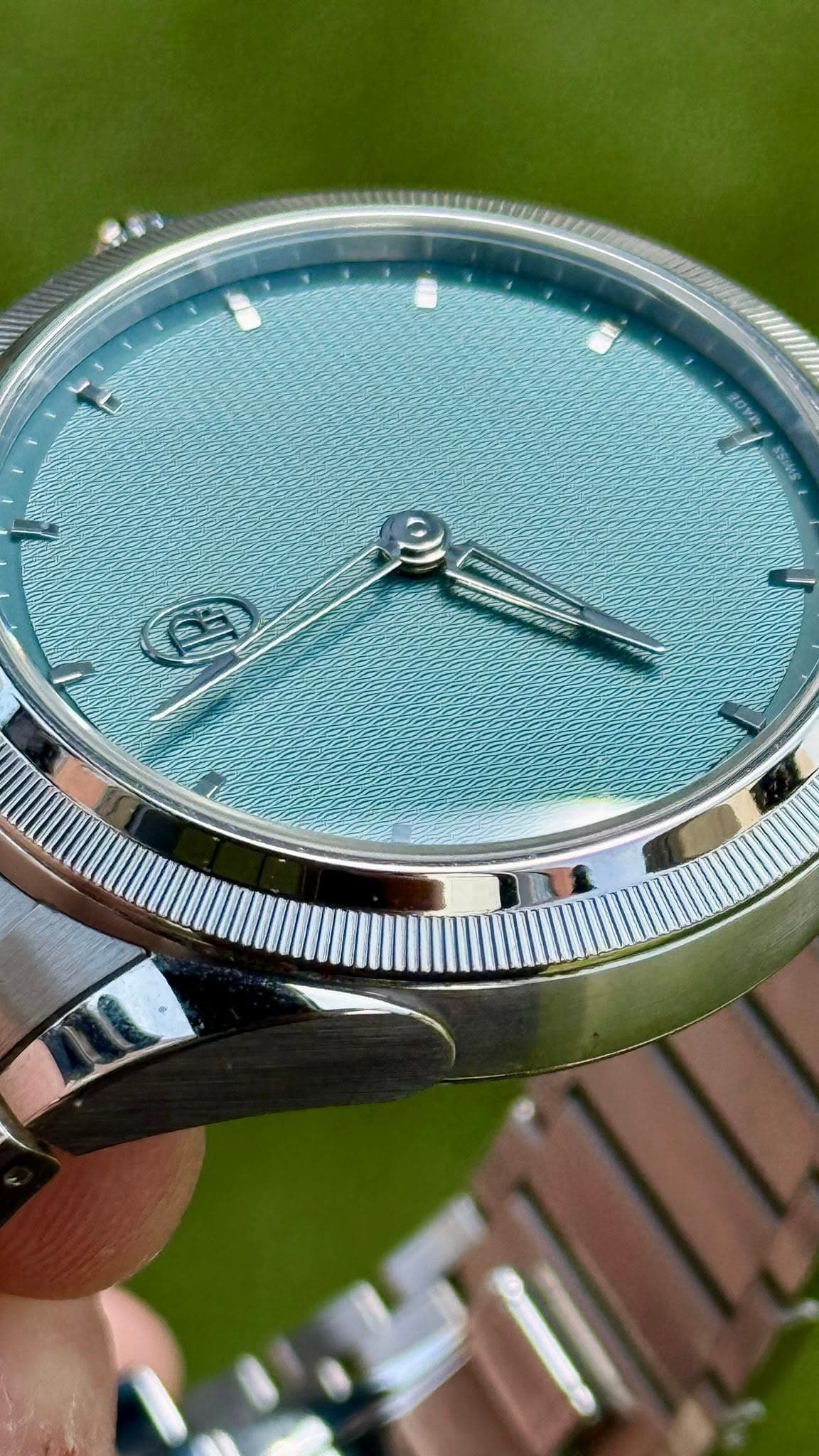 May be an image of wrist watch and text