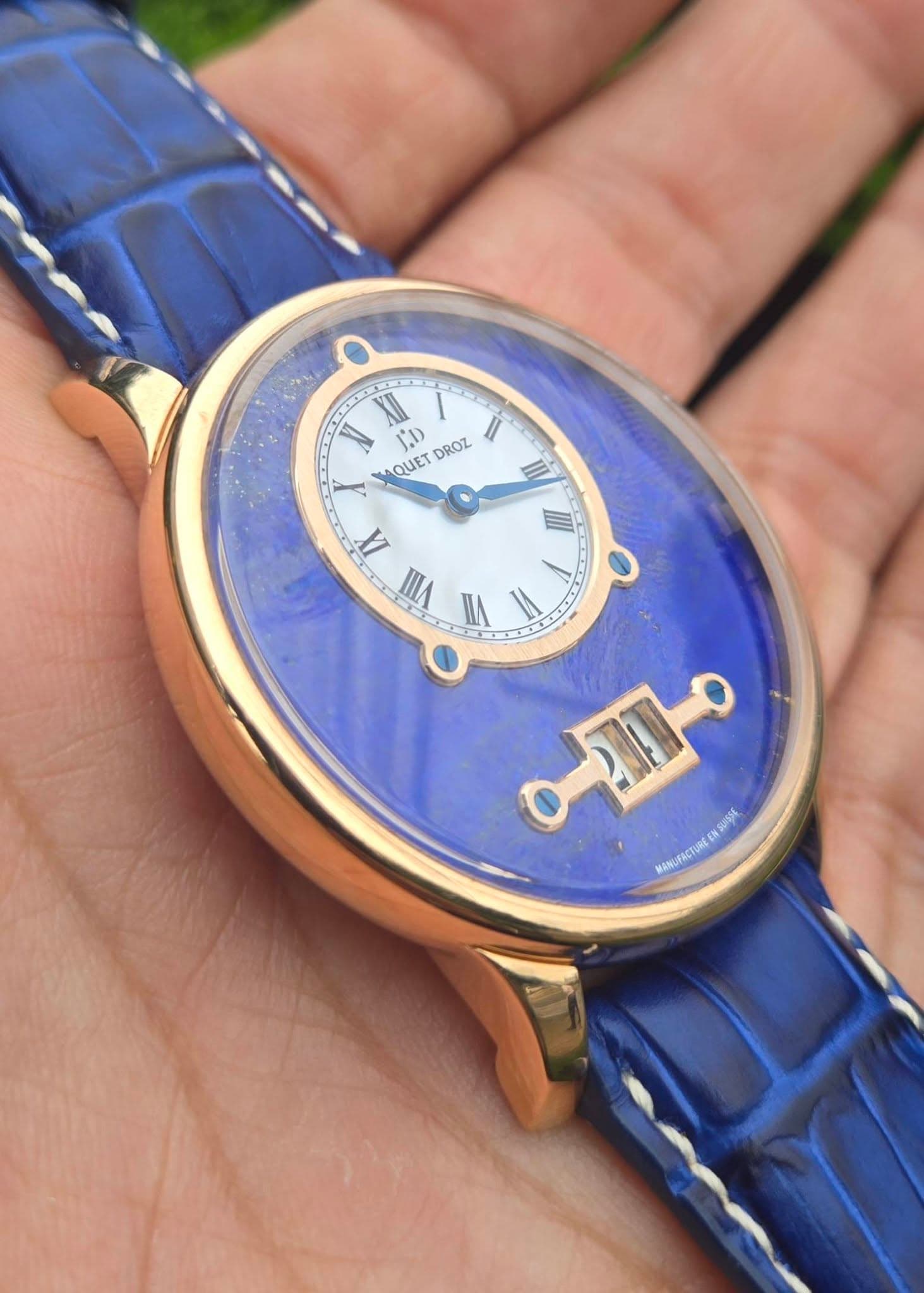 May be an image of wrist watch and text that says '٥ XI 1.1) DROZ II LQUET UET IIII A IIII o A. VIII I = 0 MANUFRCTURE FACTUREENSUISSE مـه ុ'