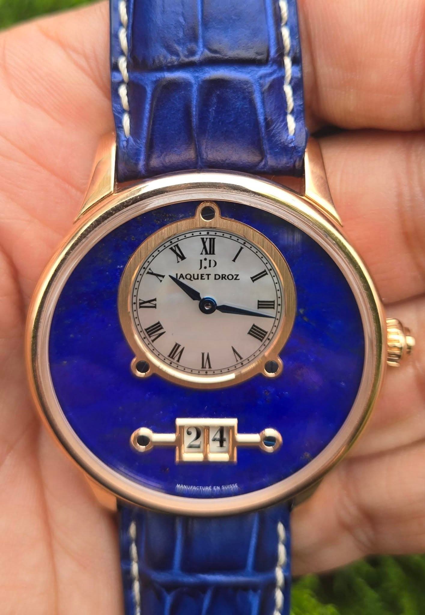 May be an image of wrist watch and text