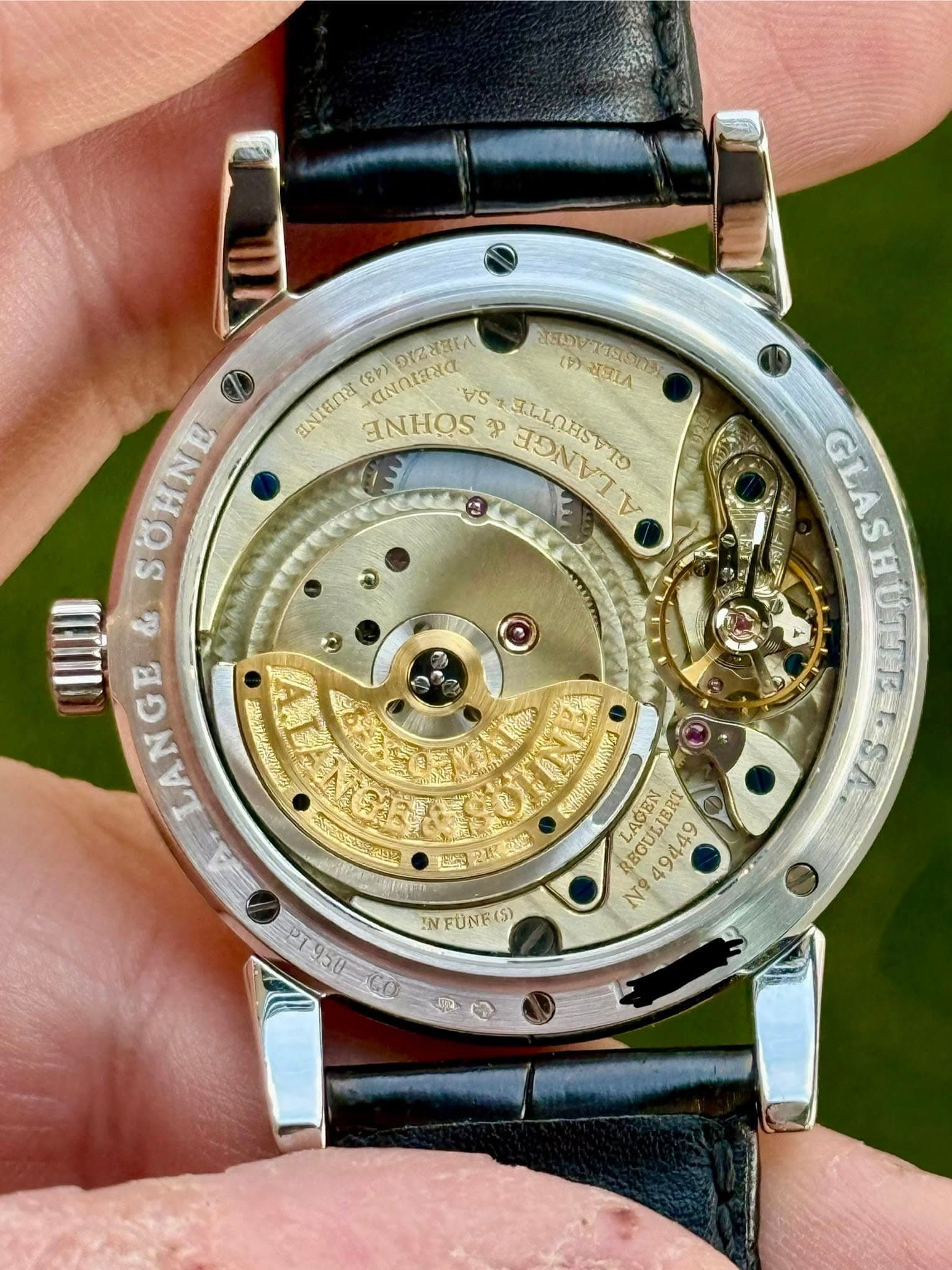 May be an image of wrist watch and text