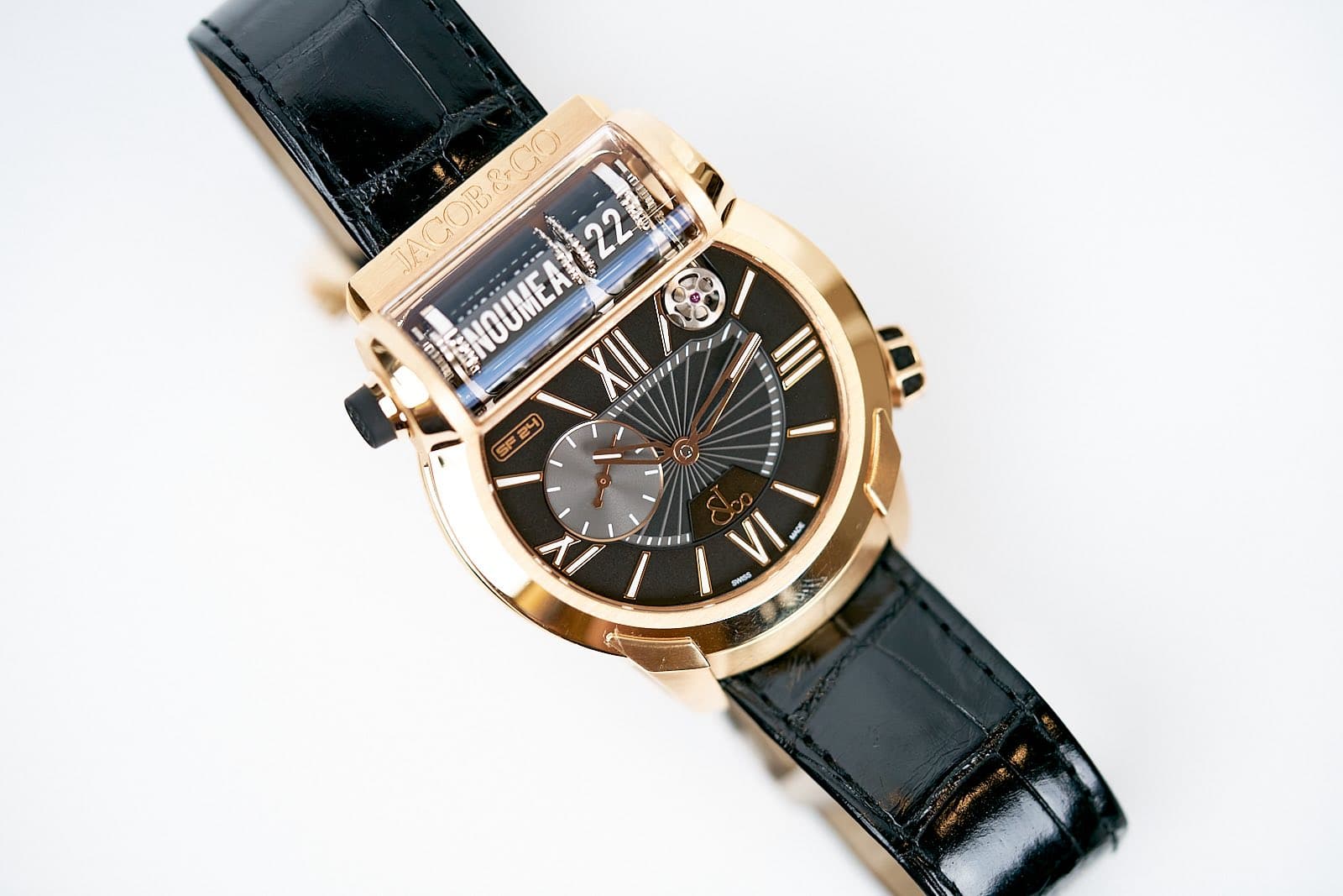 May be an image of wrist watch and text