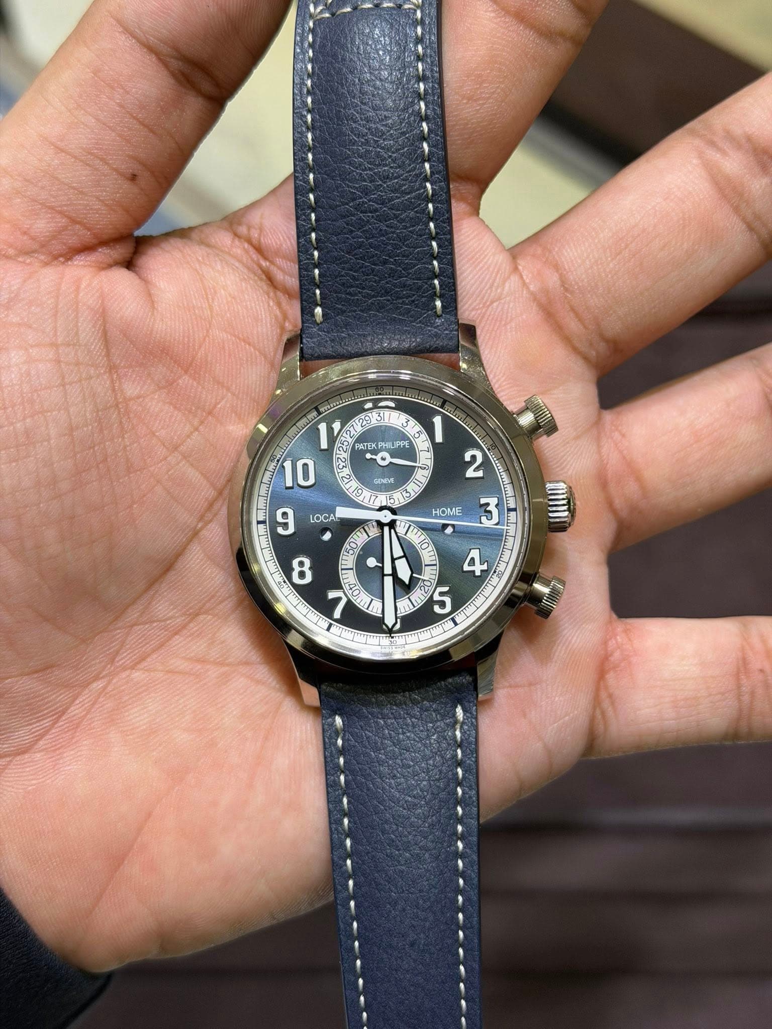 May be an image of wrist watch and text