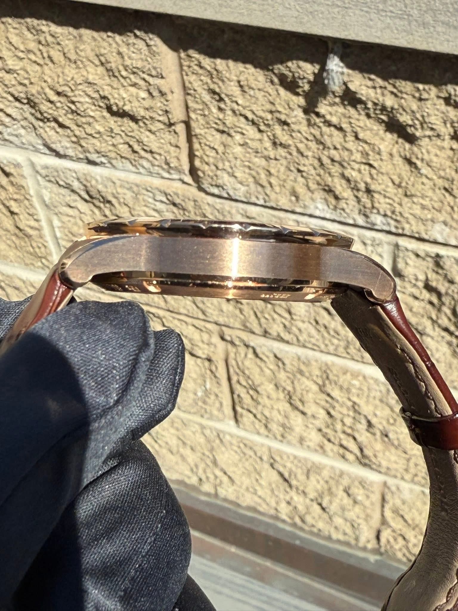May be an image of leather, wrist watch and saddle-stitched leather