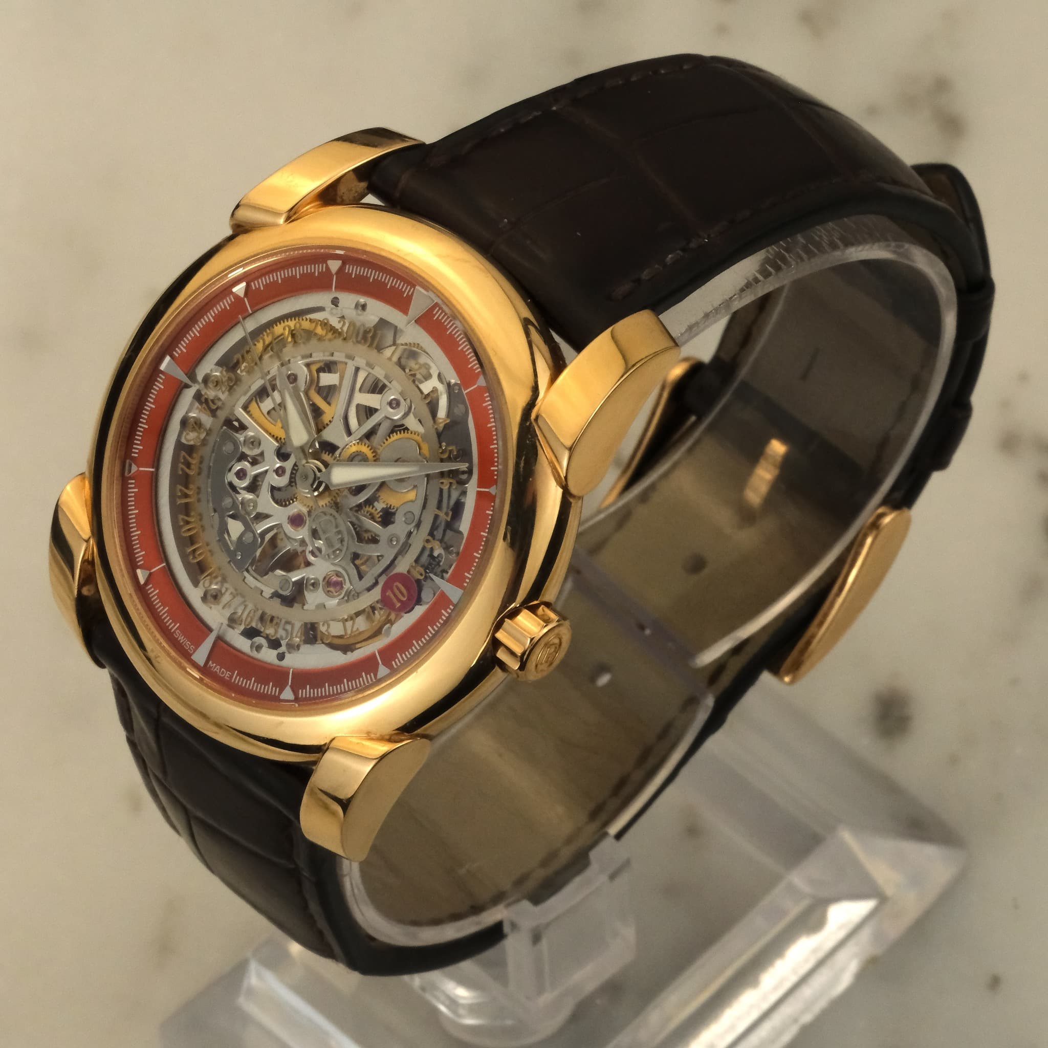 May be an image of wrist watch and text