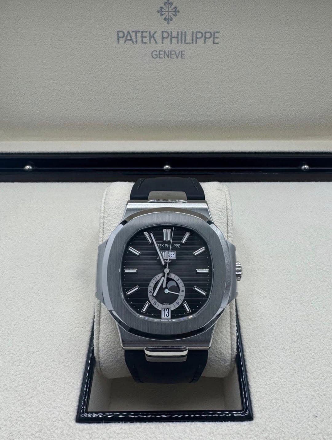 May be an image of wrist watch and text that says 'PATEK PATEKPHILIPPE GENEVE TI EKPH KPHLIP FPE ሞጣዓቲ SEP / 3 መ '