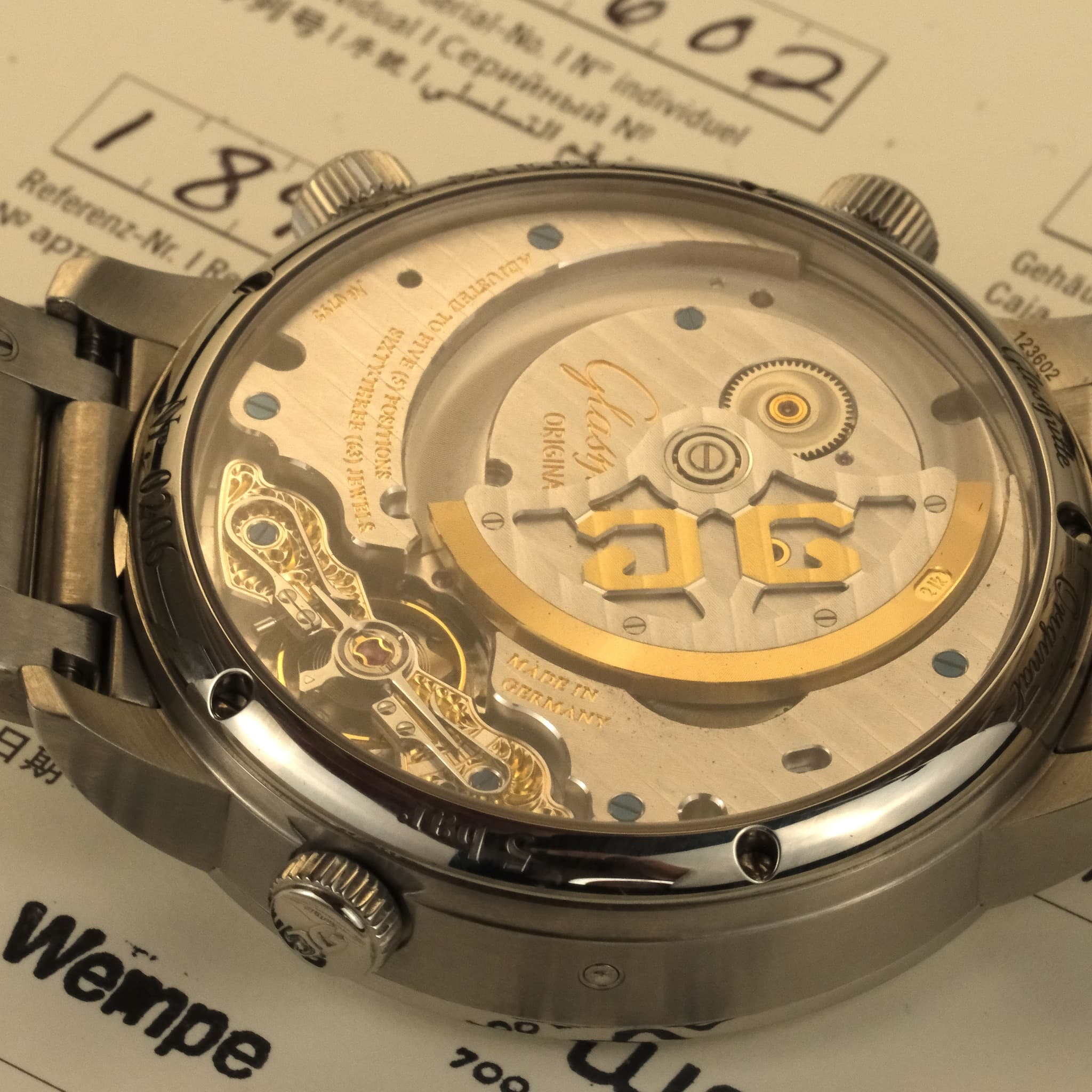 May be an image of wrist watch and text
