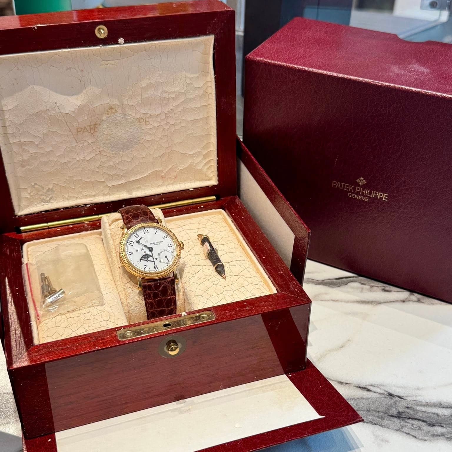 May be an image of wrist watch and text