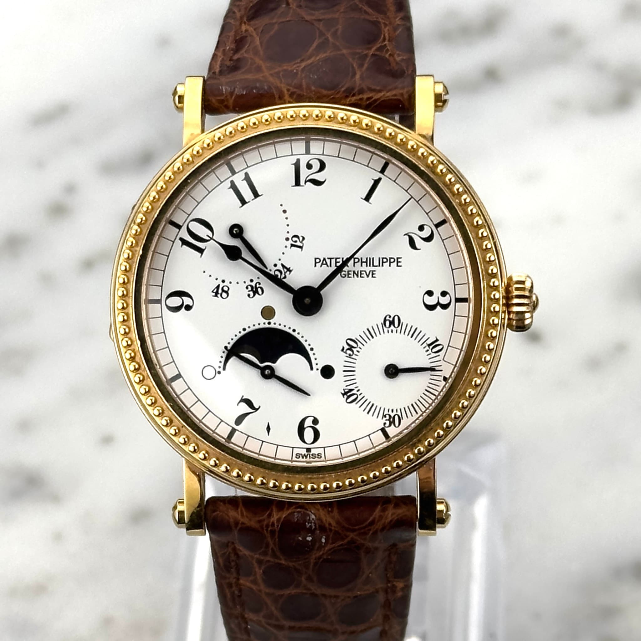 May be an image of wrist watch and text that says ' اد २ PATEKPHILIPPE PATE PHILIPPE GENEVE co 10 60 CUn O 7 0 6 SWISS ราา ธ'