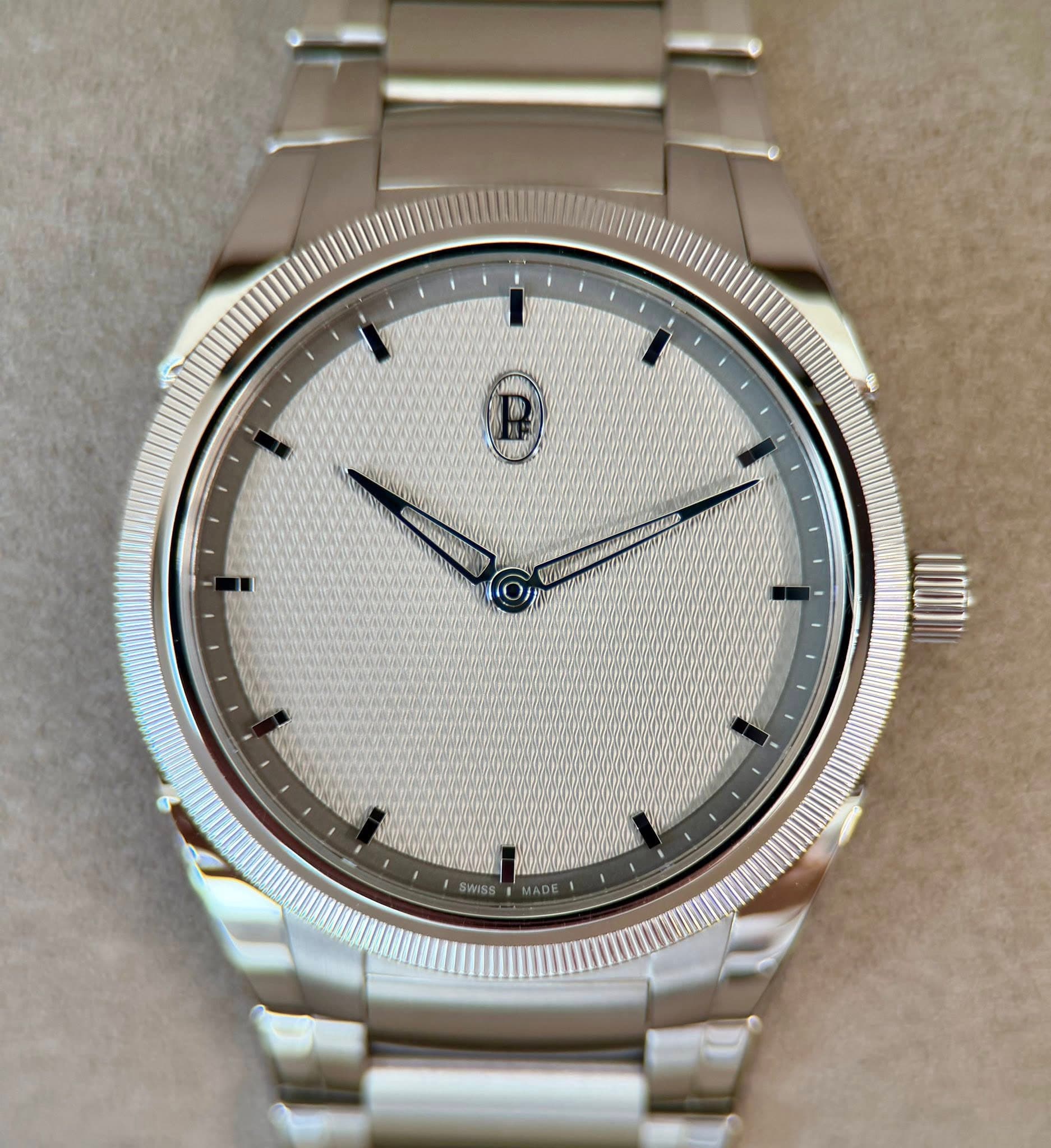 May be an image of wrist watch and text