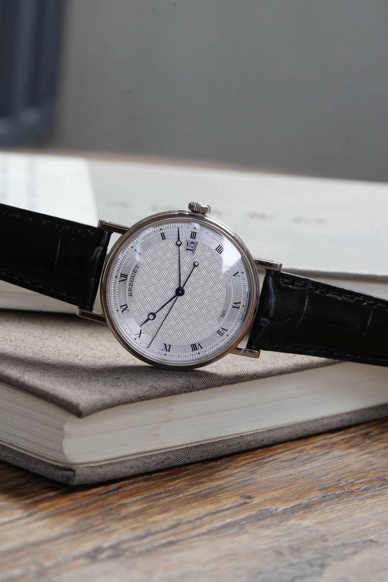 May be an image of wrist watch and text