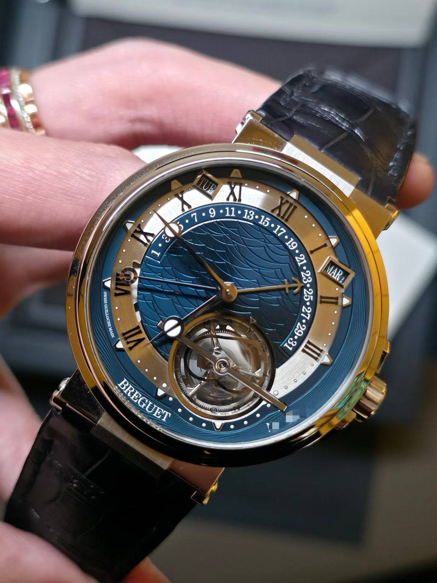 May be an image of wrist watch and text