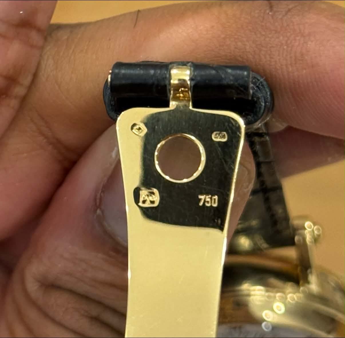 May be an image of wrist watch and text
