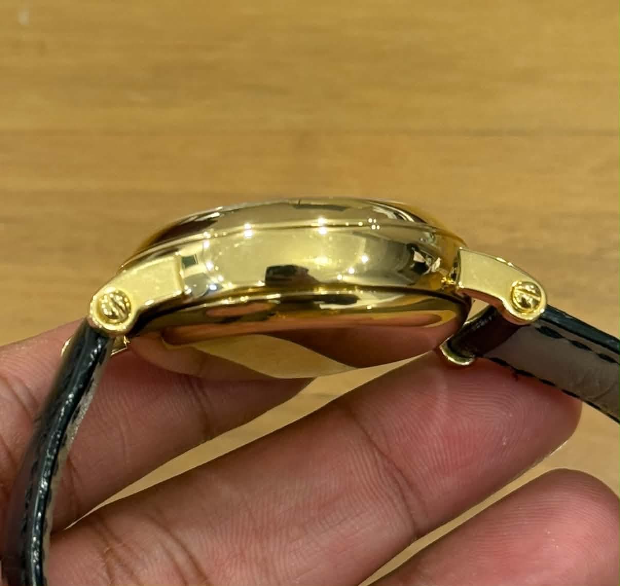 May be an image of wrist watch