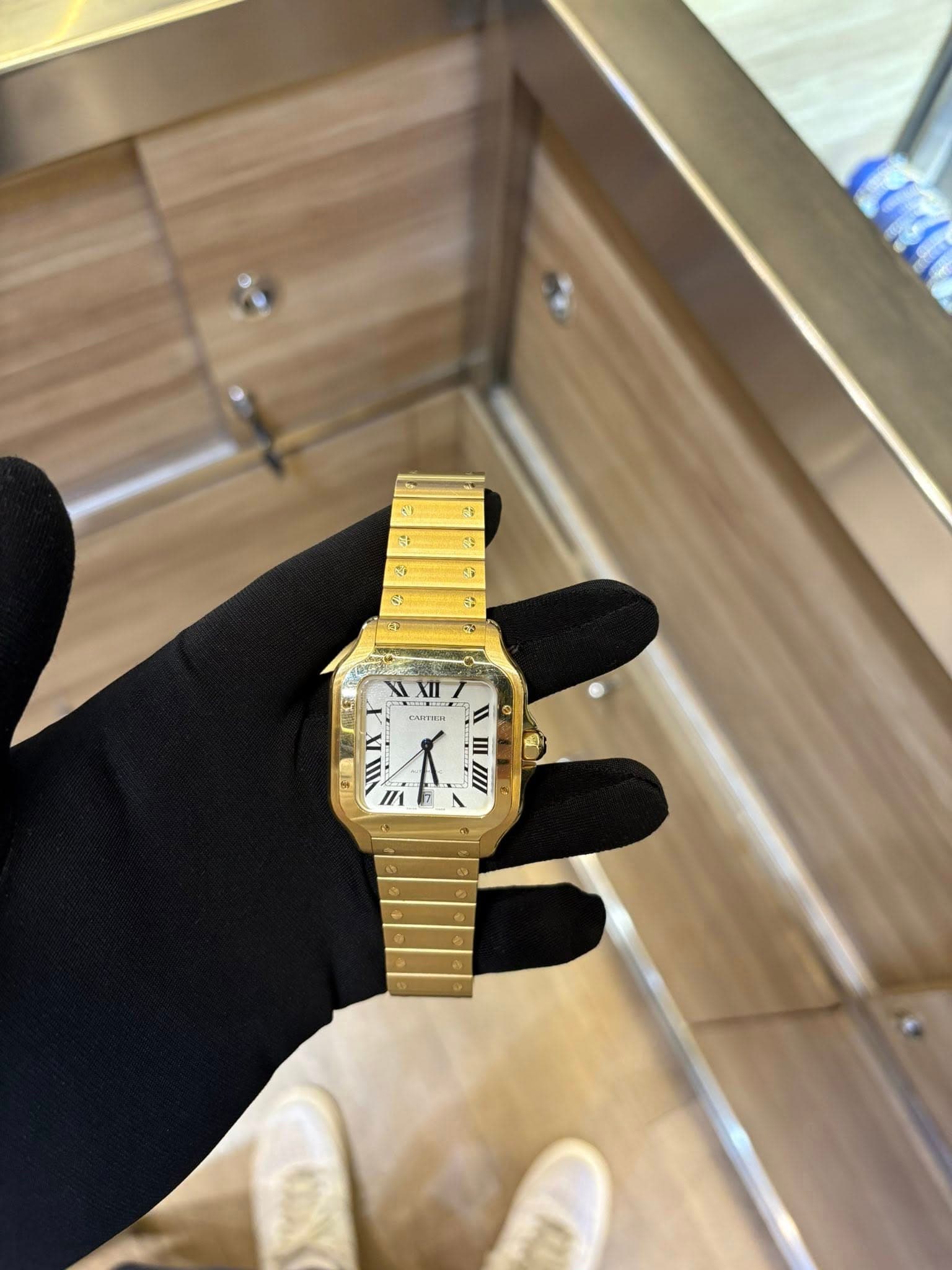 May be an image of wrist watch and text