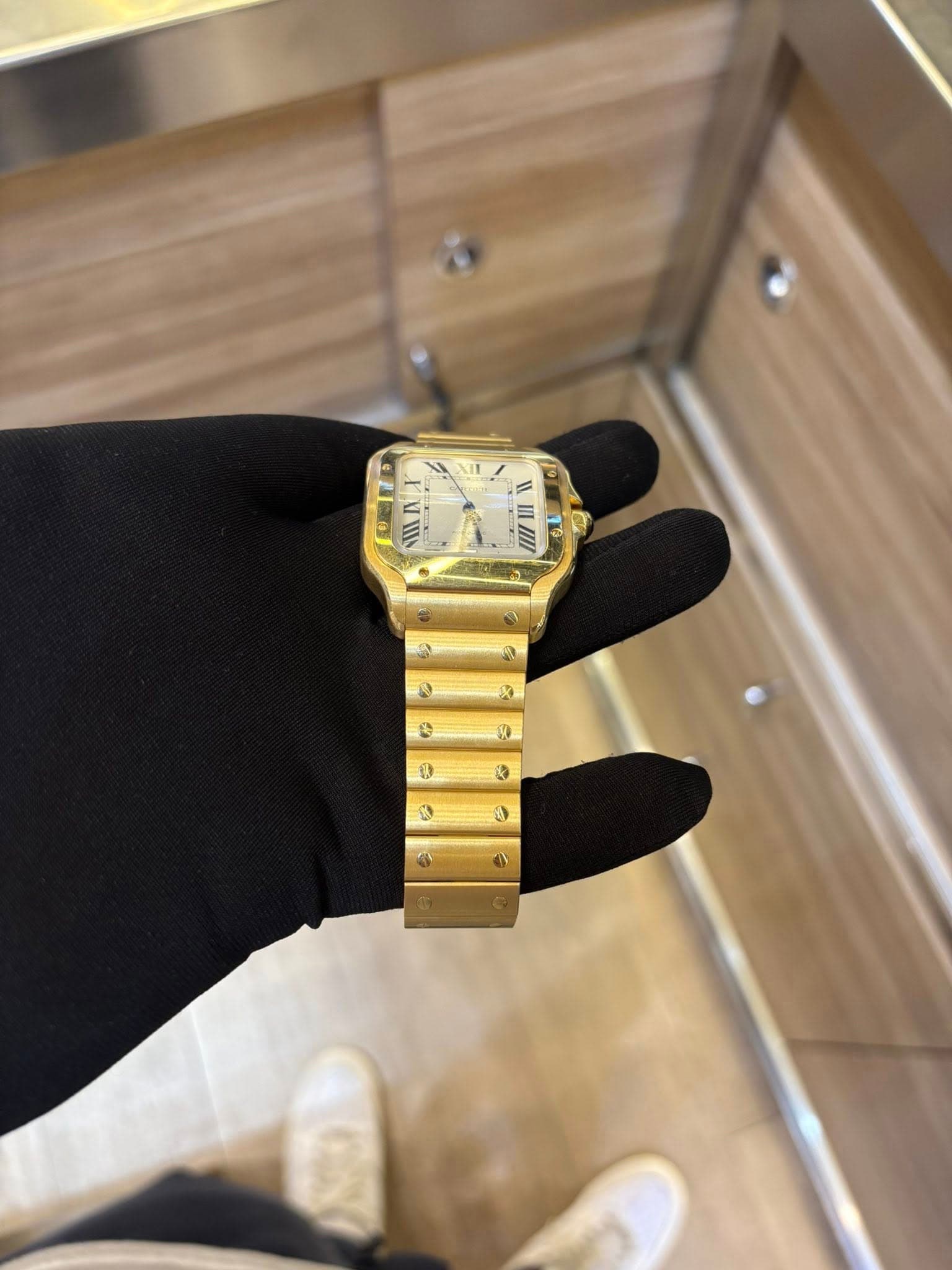 May be an image of wrist watch and text that says 'III 0 3'