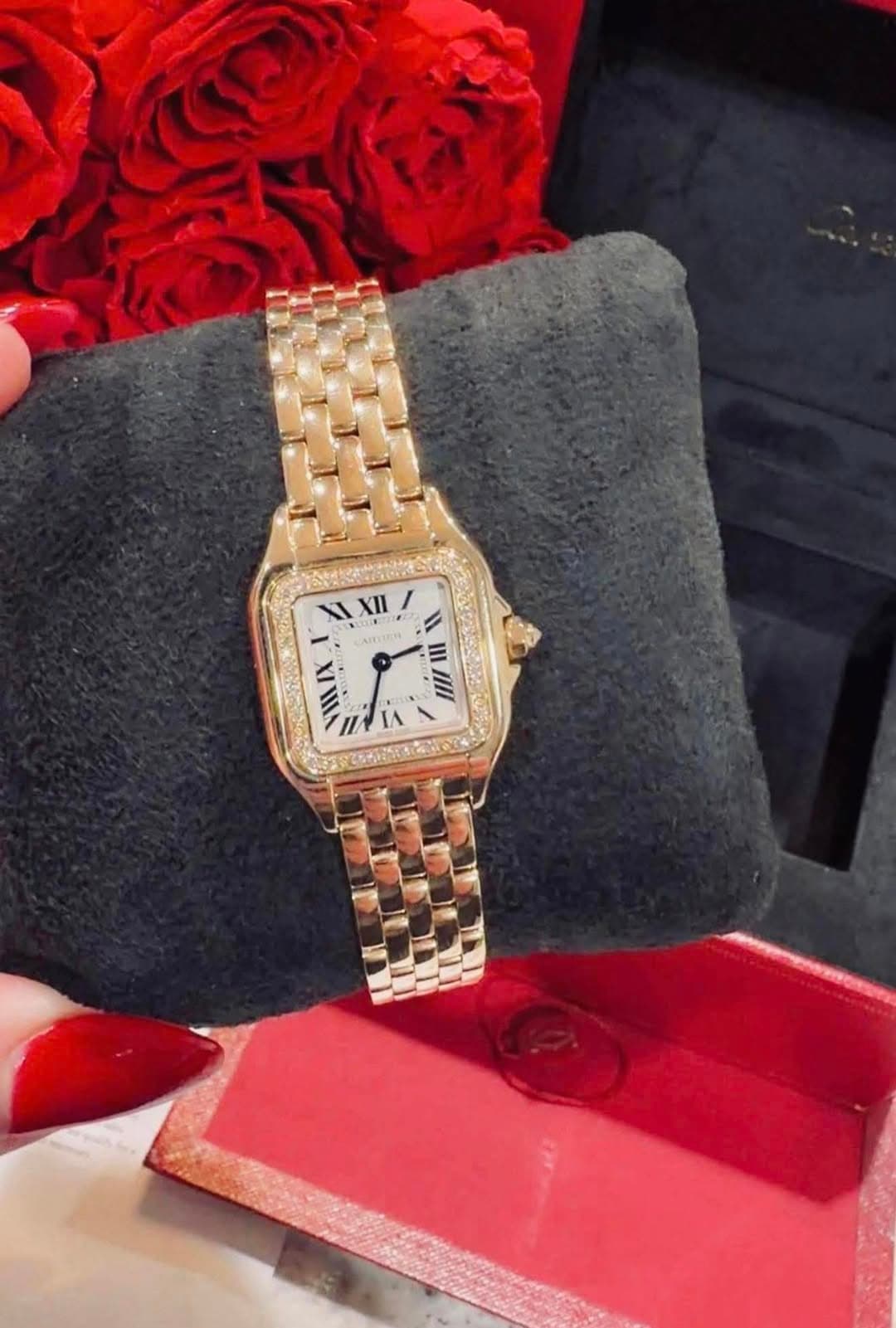May be an image of wrist watch and text